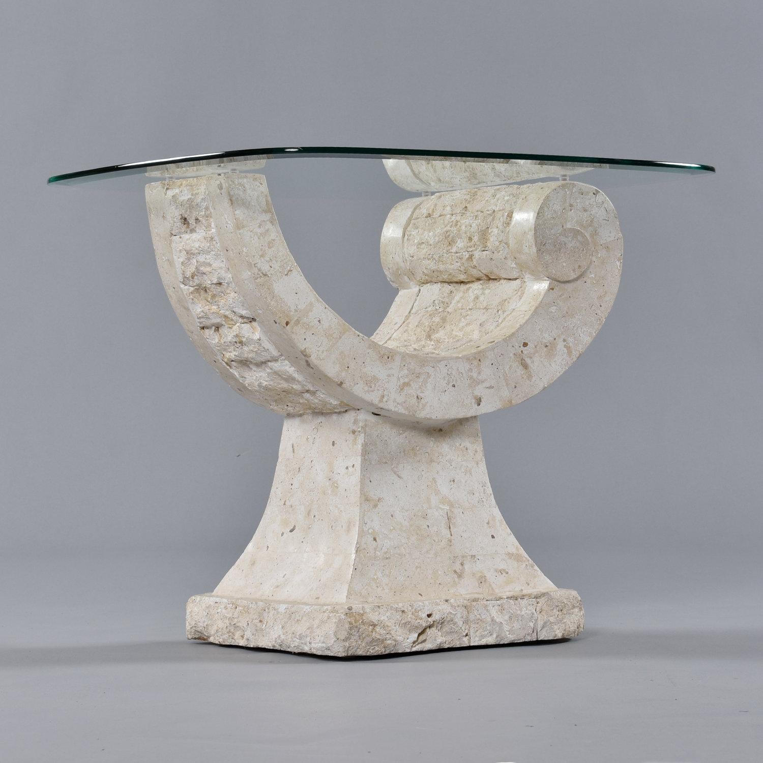 Art Deco inspired, elegantly curved tessellated stone coffee table. The table base is made of Mactan stone, a type of coral. It seems fitting that this base made of coral mimics the graceful contour of a seashell. Made in the Philippines, vintage