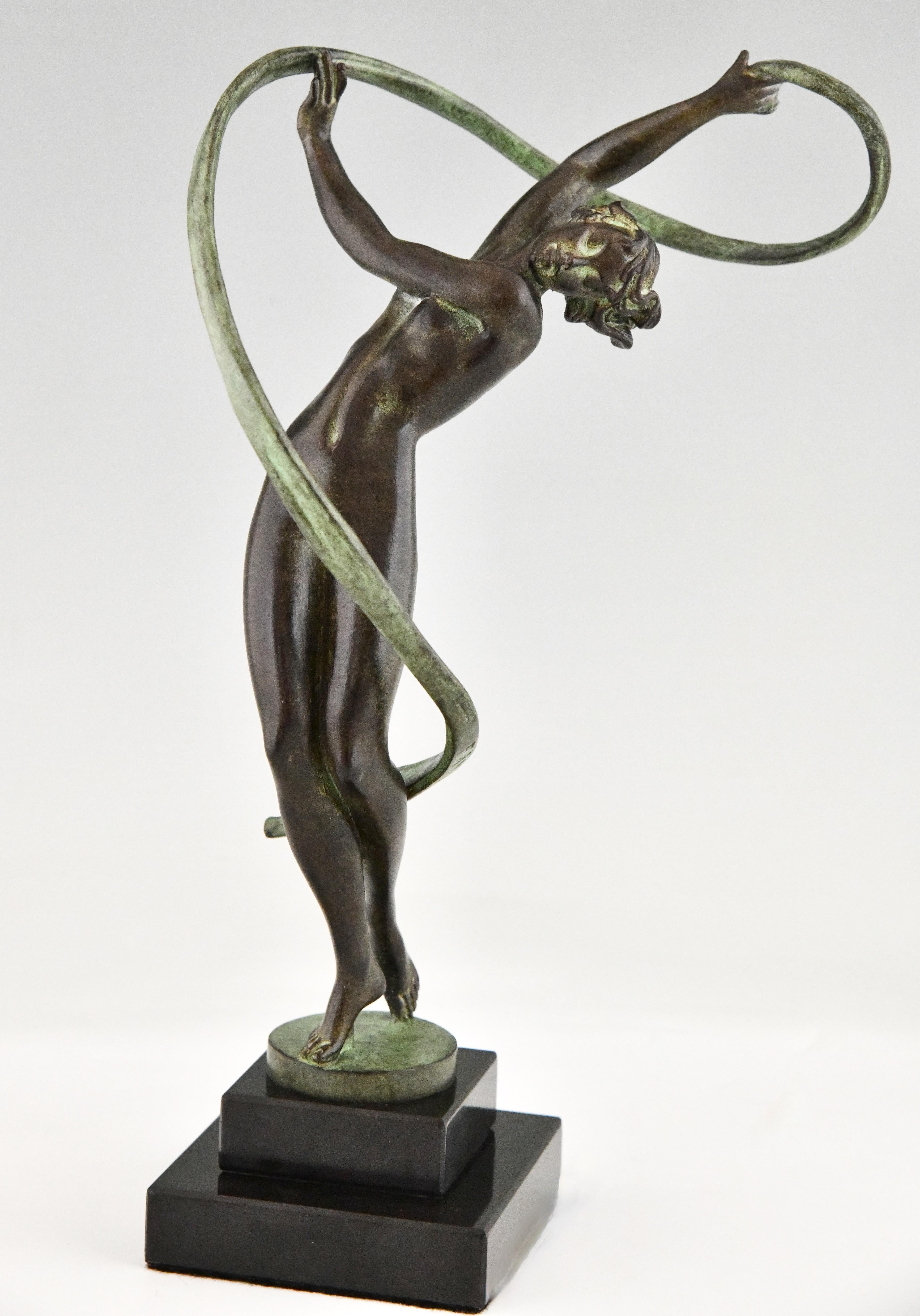 Art Deco style sculpture dancer Tourbillon, nude with ribbon by Fayral, pseudonym of Pierre Le Faguays. 
With the Le Verrier foundry mark. 
Patinated Art Metal on a black marble base. 
Design 1930.
Posthumous contemporary cast of the Le Verrier