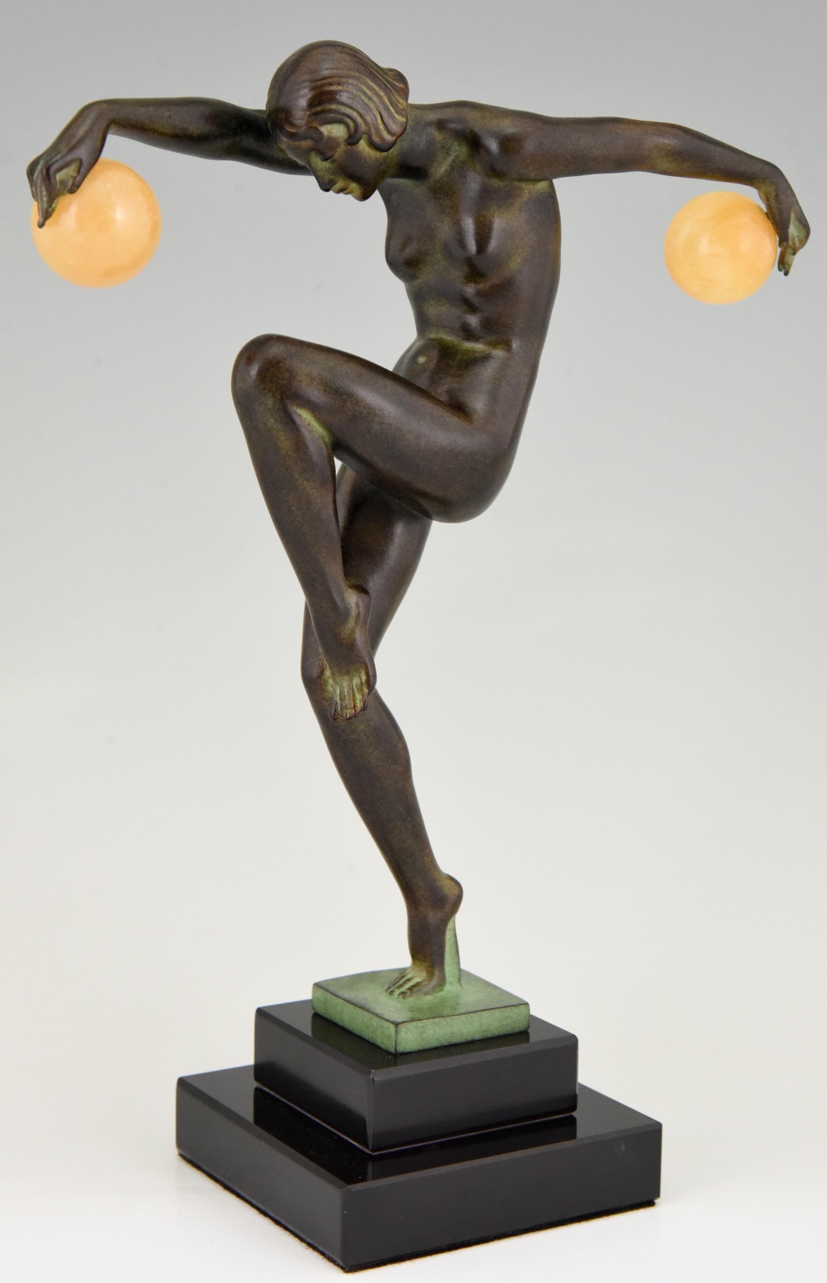 Elegant sculpture in Art Deco style, ball dancer signed by Denis. 
With foundry mark. 
Cast at the Max Le Verrier foundry. 
Designed ca. 1930. 
Posthumous contemporary cast. 
Patinated Art metal on a stepped black marble base. 
With