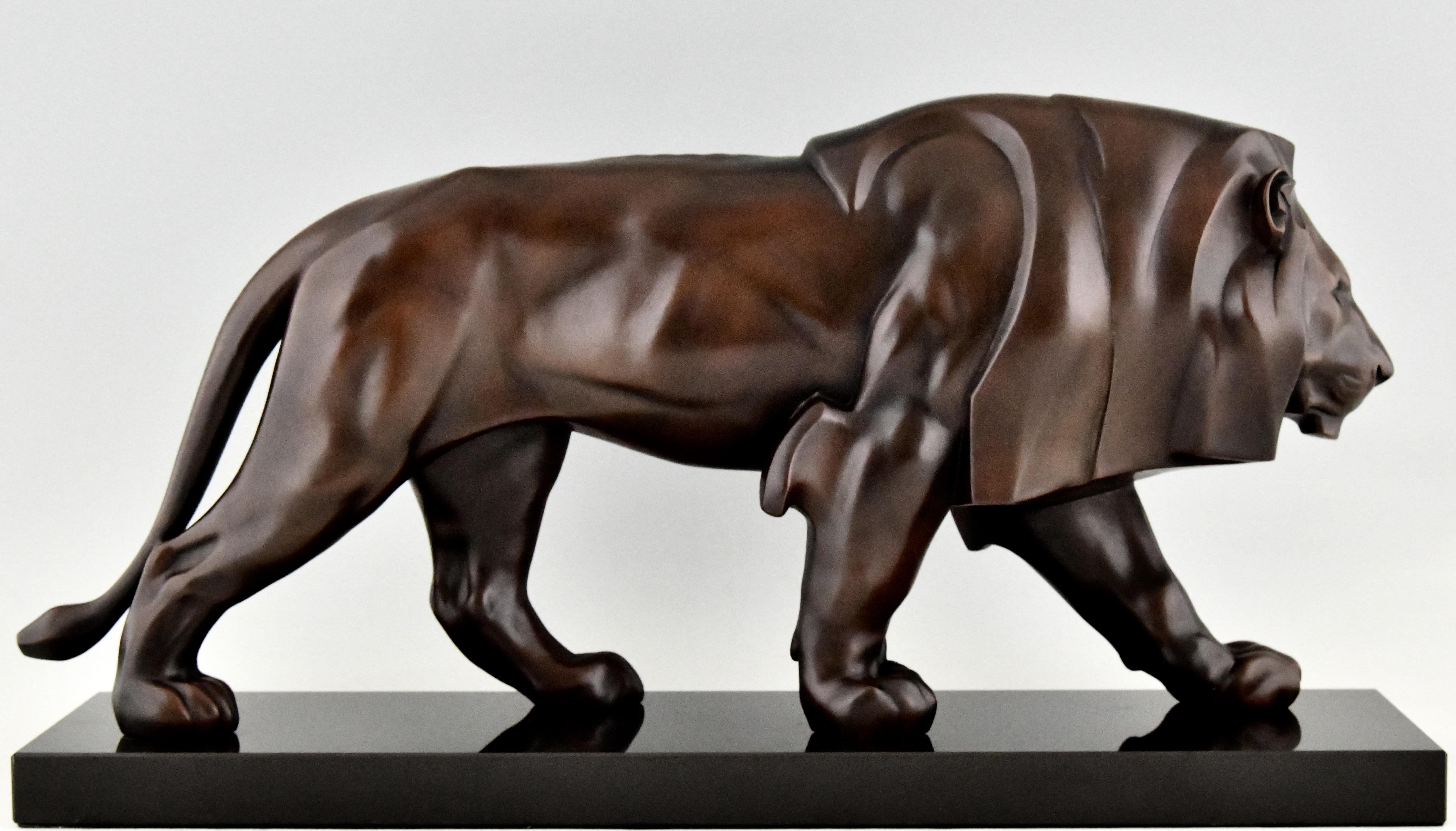Very impressive Art Deco style sculpture of a walking lion by the famous French sculptor Max Le Verrier. 
Art metal with beautiful dark brown patina on a black marble base. 
Contemporary Posthumous cast at the Le Verrier foundry. 
Signed and with