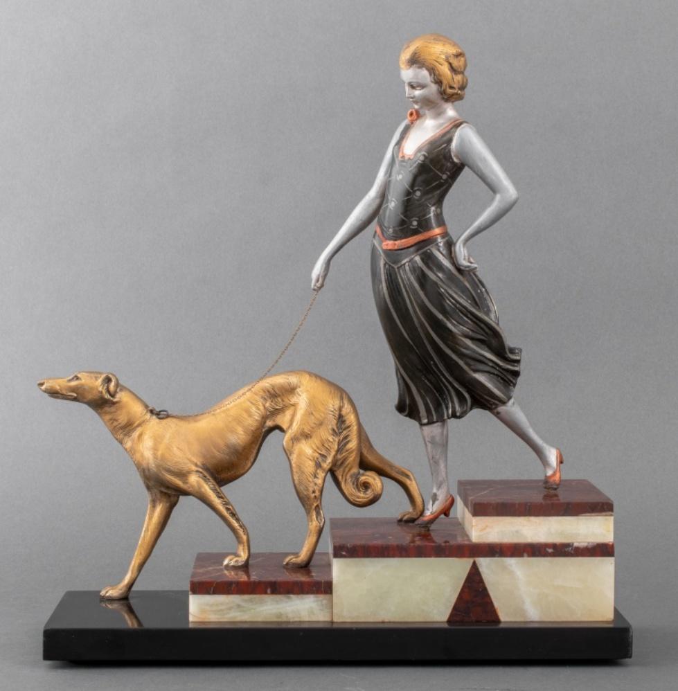 Art Deco style spelter sculpture raised on a polychrome marble base depicting a lady with greyhound on a leash, apparently unsigned. 15.5