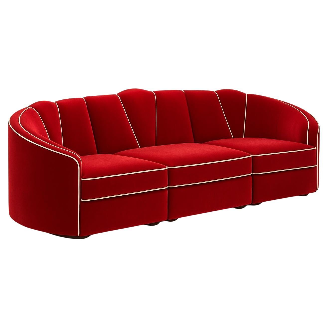 Inspired by the timeless elegance of the Art Deco era, the Josephine Sofa showcases a graceful fan-shaped motif with flowing curves and a luxurious, opulent finish. Its sculptural silhouette is beautifully highlighted by contrasting tonal piping,