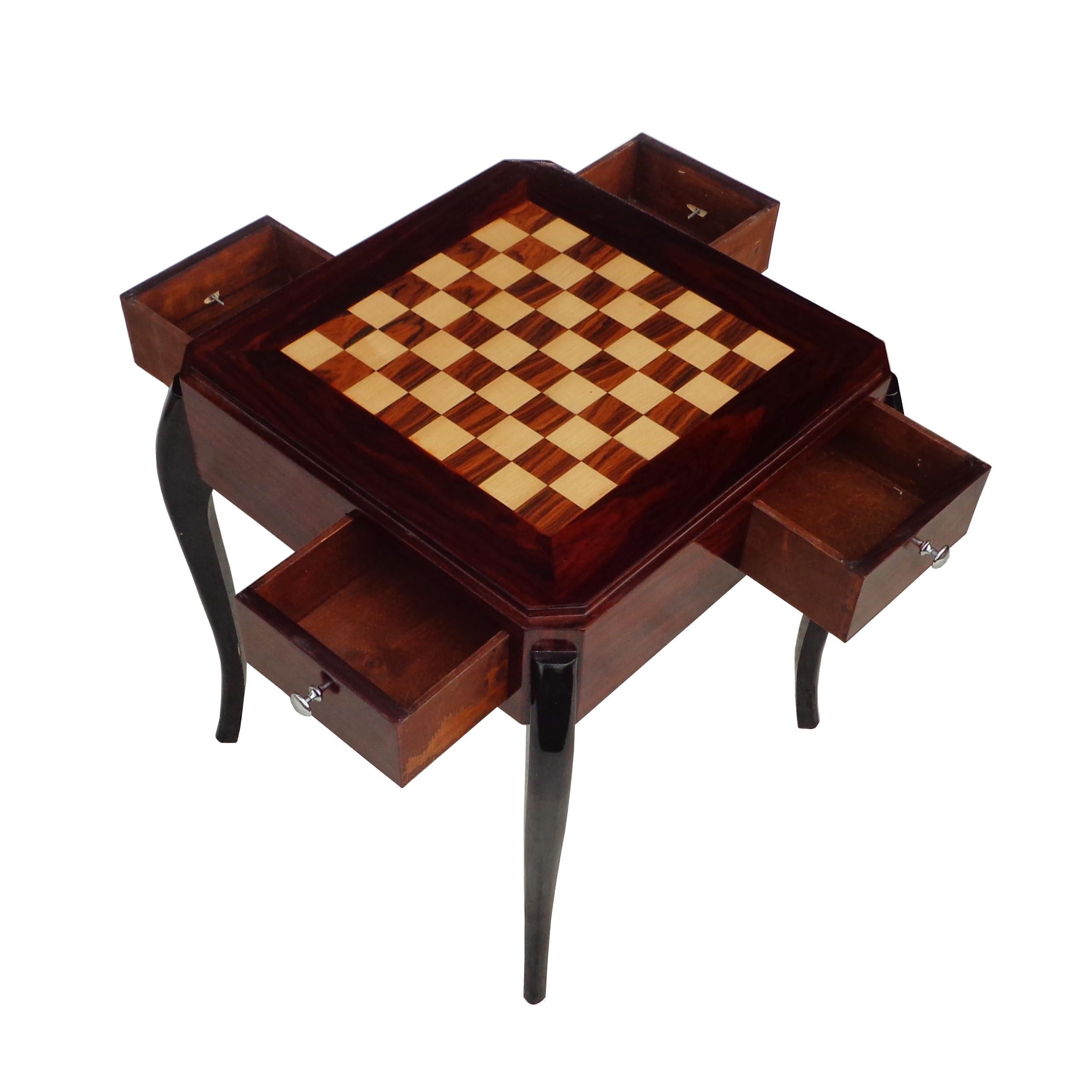 Art Deco style game side table

Rosewood veneer paired with ebonized cabriole legs and chess/checkboard top. Four drawers with nickel pulls.

2 available.






 