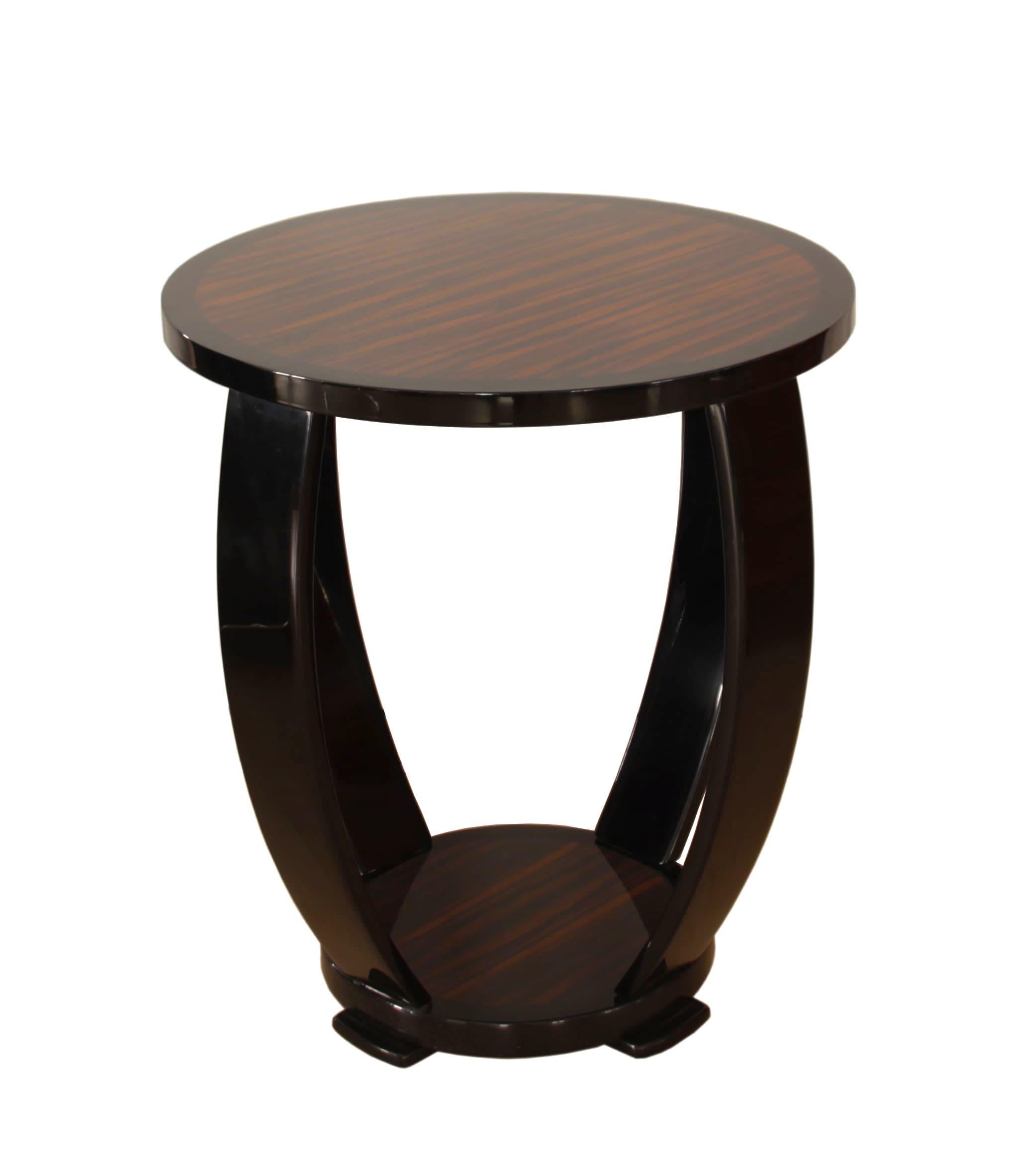 Elegant and Classic French Art Deco style side table or Guéridon.

Plates veneered in Macassar. Side bolsters ebonized / black lacquered.
Amazing hard Polyester piano lacquer, polished.

Handcrafted after original design, built in South