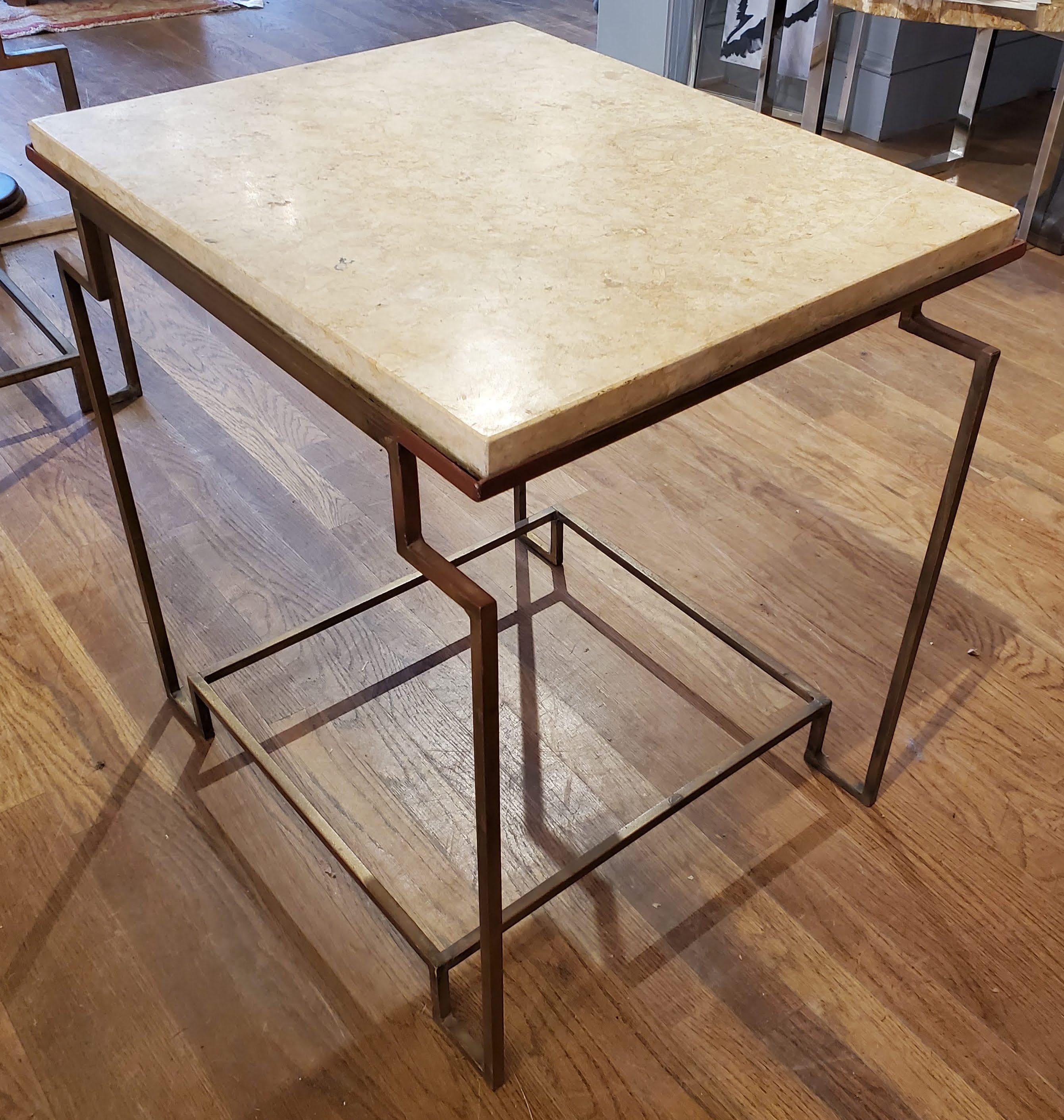 This Art Deco style gilt metal “Apollo” occasional table makes a sleek addition to any room. Custom designed and fabricated by Hastening Designs with excellent proportions. This is a very architectural side table with a “distressed” gilt finish to