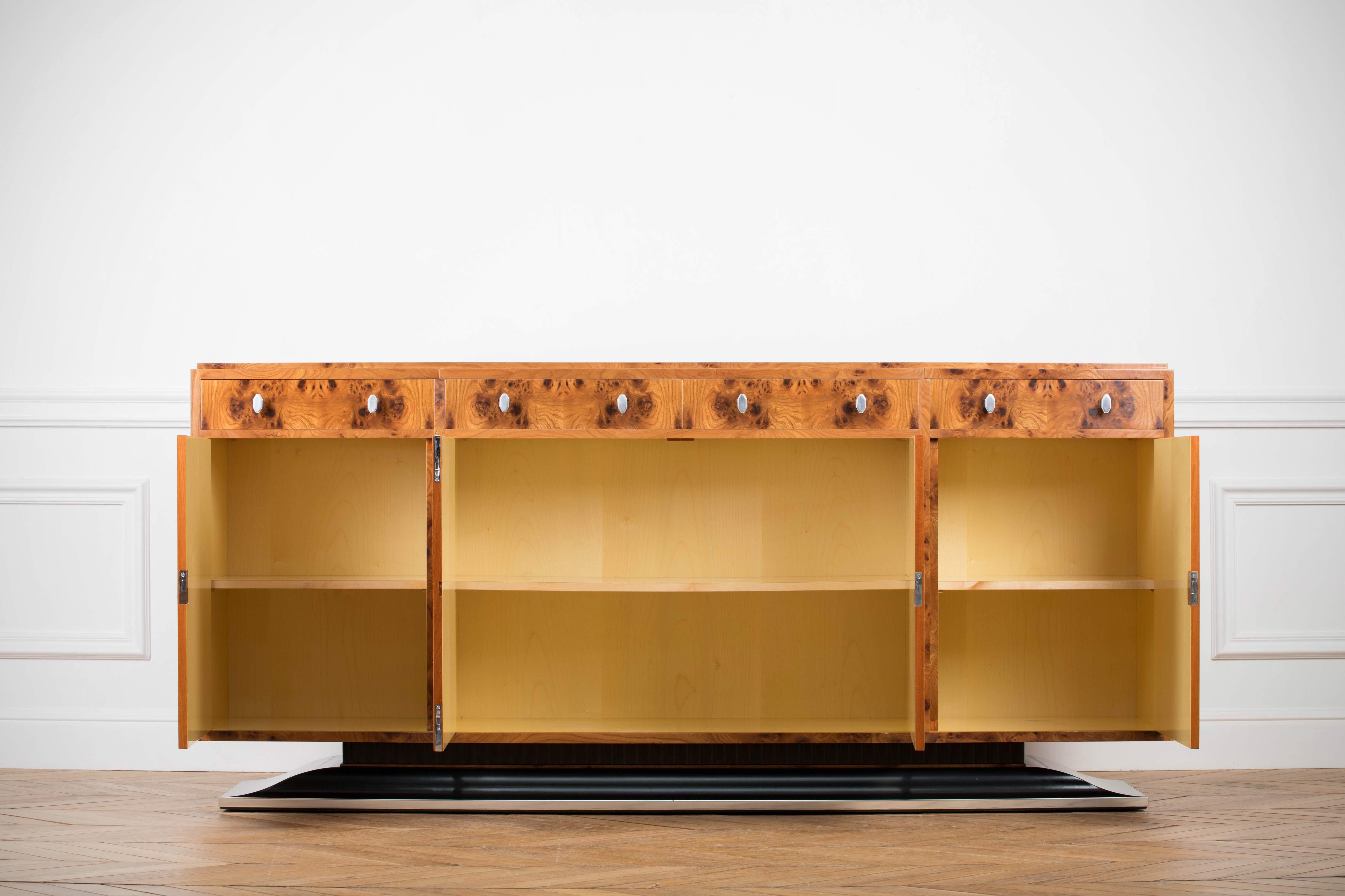 Art Deco style sideboard labelled by Restall Brown and Clenel, late 20th century in date.
Art Deco is a style of visual arts, architecture and design that first appeared in France just before World War I. It combined modernist styles with fine