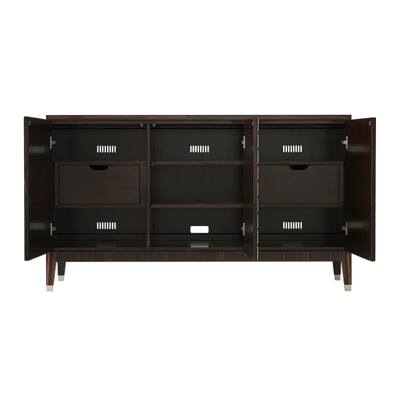 An Art Deco-inspired sideboard with exotic veneered top and sides with lacquered cast composite relief paneled doors, the three-section interior with adjustable shelves and drawers on square tapered legs with polished nickel finish