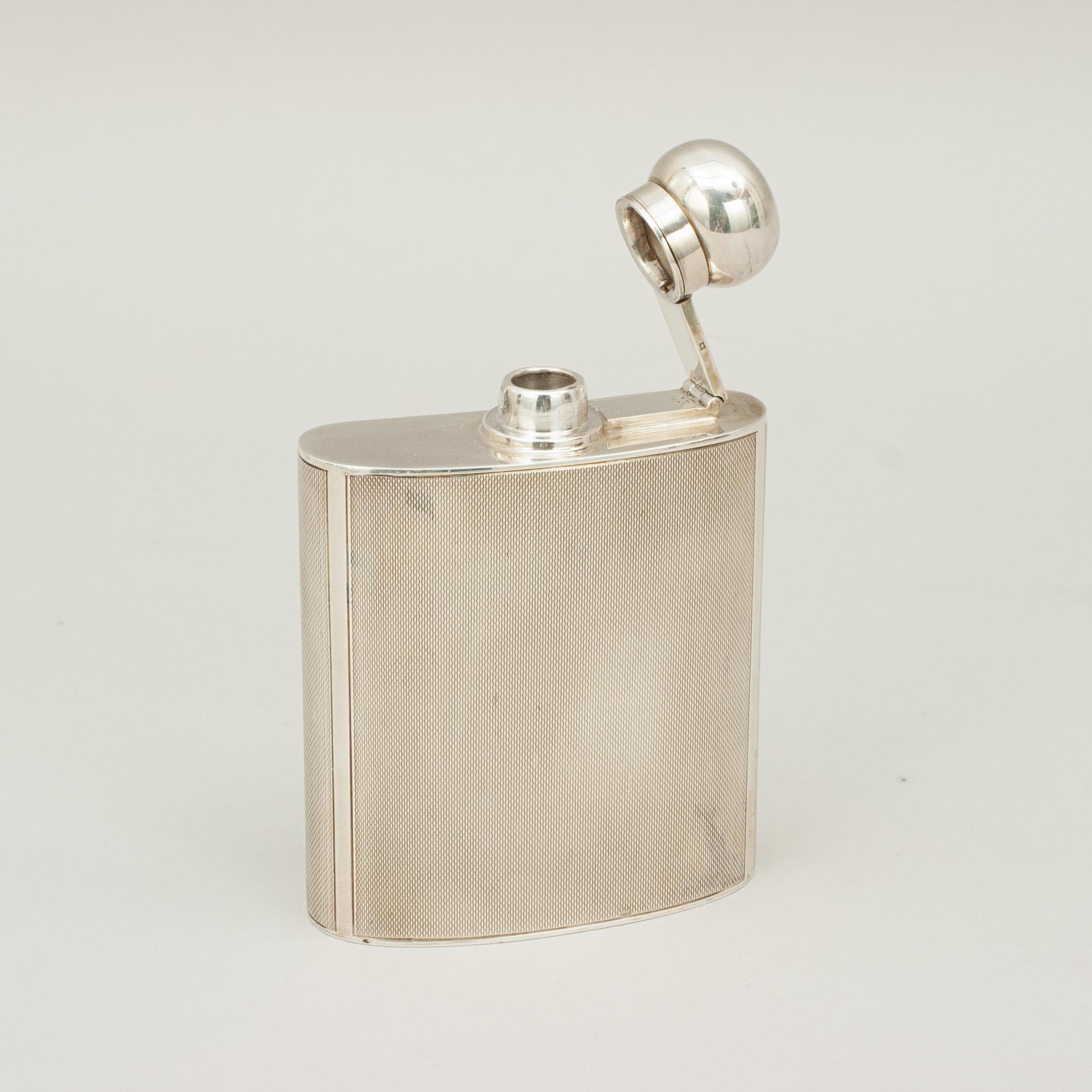 Art Deco style silver hip flask
A good shaped hip flask with hinged bayonet top. A beautiful piece with machined finish. Hallmarked Birmingham 1963 with makers initials J.G Ltd. (Joseph Gloster Ltd.1908-1978, Lion Silver Works, Hockley Hill,