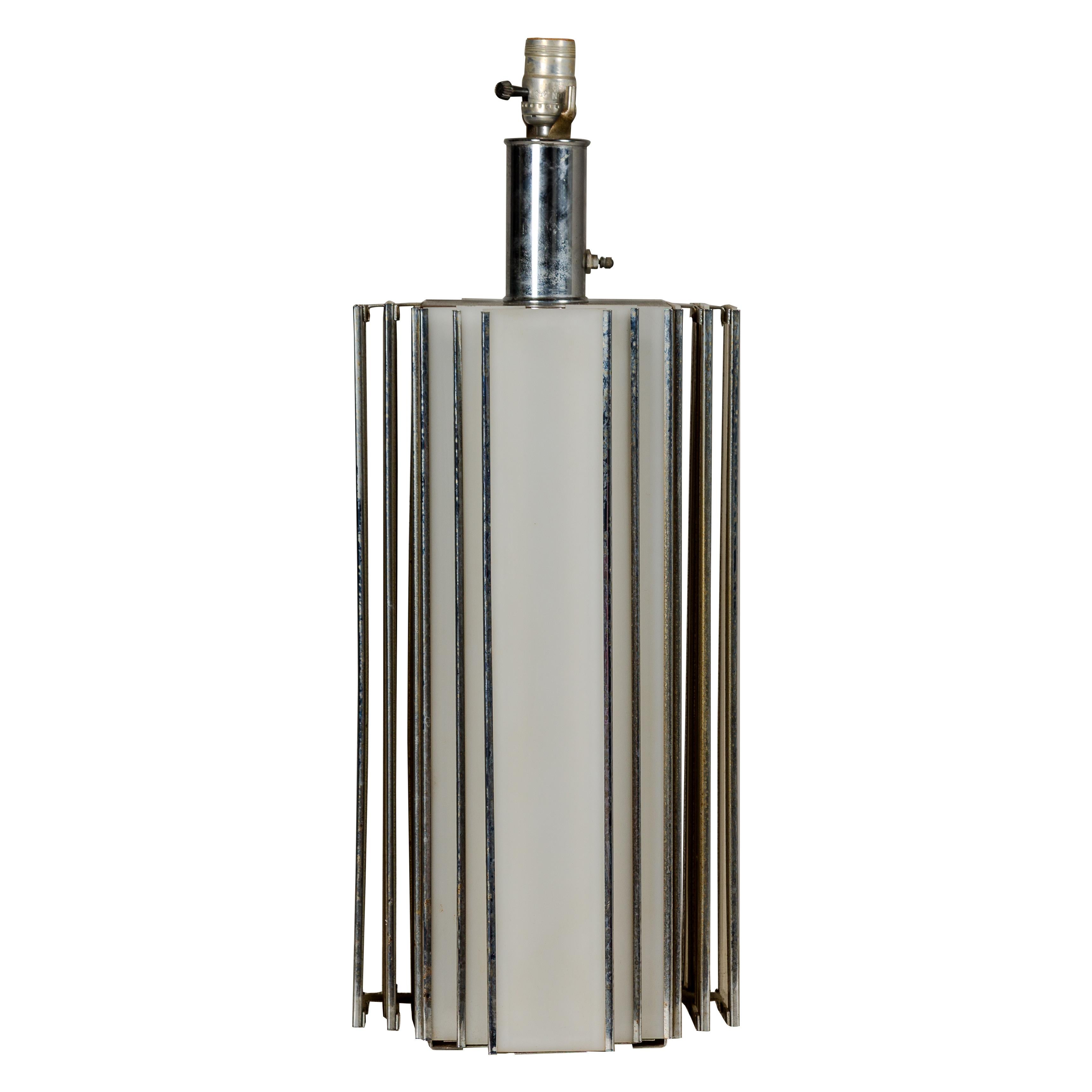 An Art Deco style skyscraper table lamp from the Midcentury period with two lights. Envelop your home in the captivating allure of the Midcentury era with this exquisite Art Deco style skyscraper table lamp. Its sleek, geometric form, reminiscent of