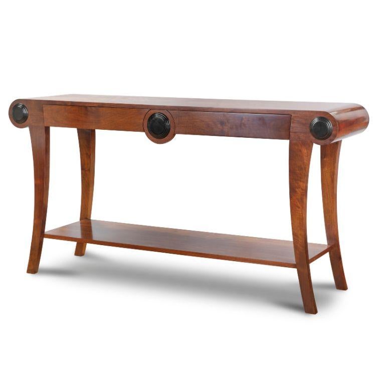 Handcrafted from solid walnut, Beaumont & Fletcher's Duke console table is an example of fine English furniture at its very best. 
This Art Deco style piece has an exceptional finish with a starburst veneer top and ebonised inlay detailing.
The