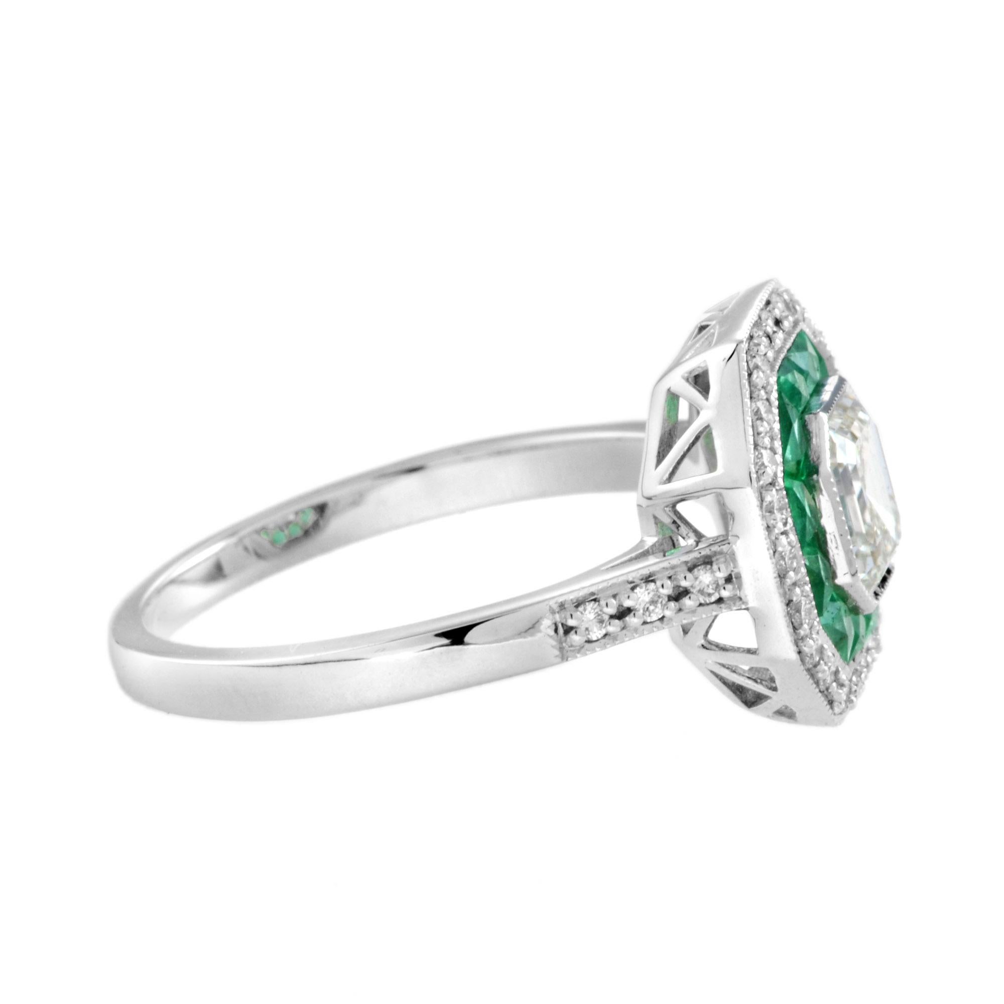 An 18k white gold Art-Deco design diamond and sapphire target ring, center K/VS diamond with an inner halo of French cut emeralds and outer round diamonds with finished with millgrain edging, finished with diamond shoulders.
Ring Information
Style: