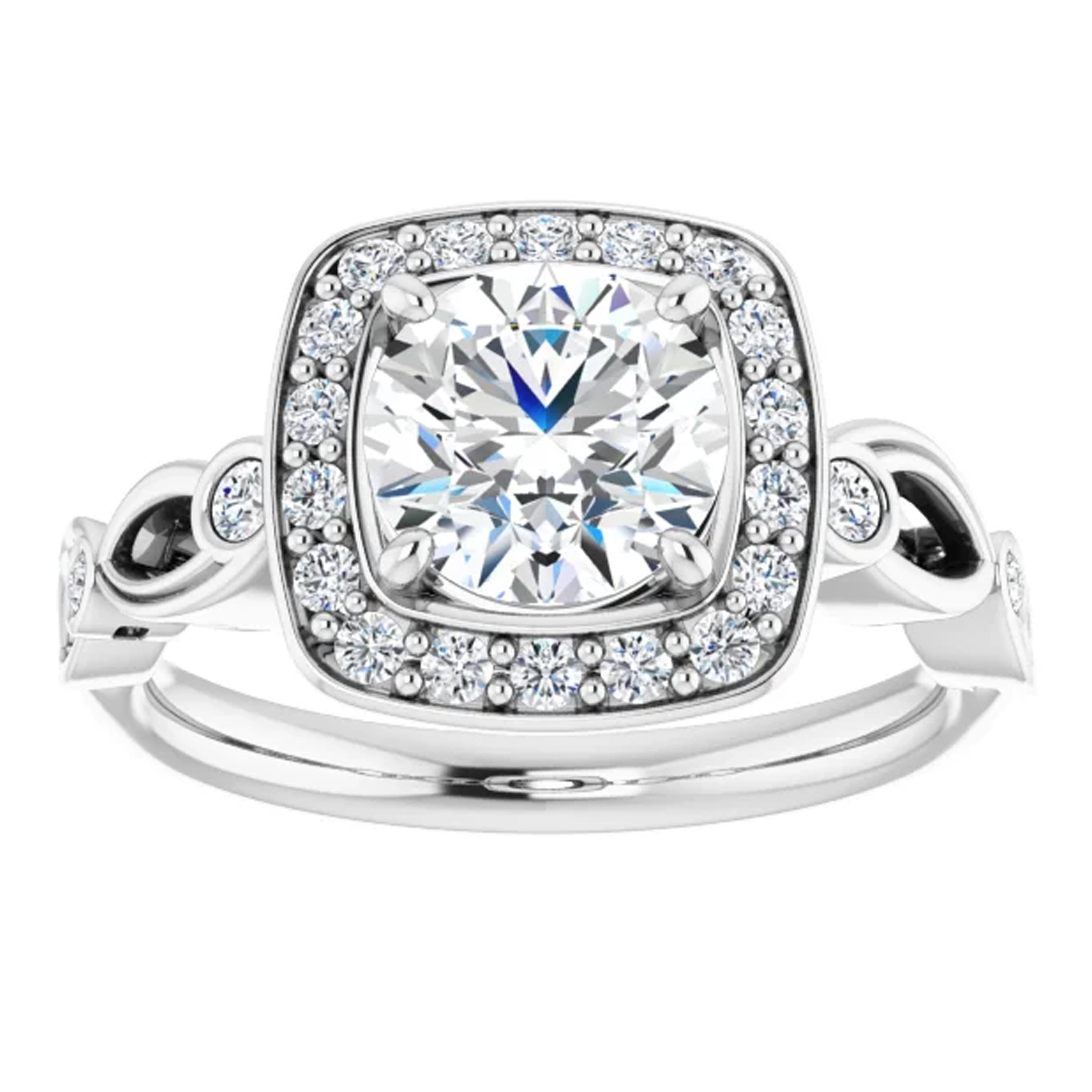 Amplified by a square halo of white shimmering diamonds, the GIA certified round brilliant diamond shines gloriously in the center. Intricate filigrees decorate the gallery. Additional diamonds line the 14k white gold handcrafted wedding