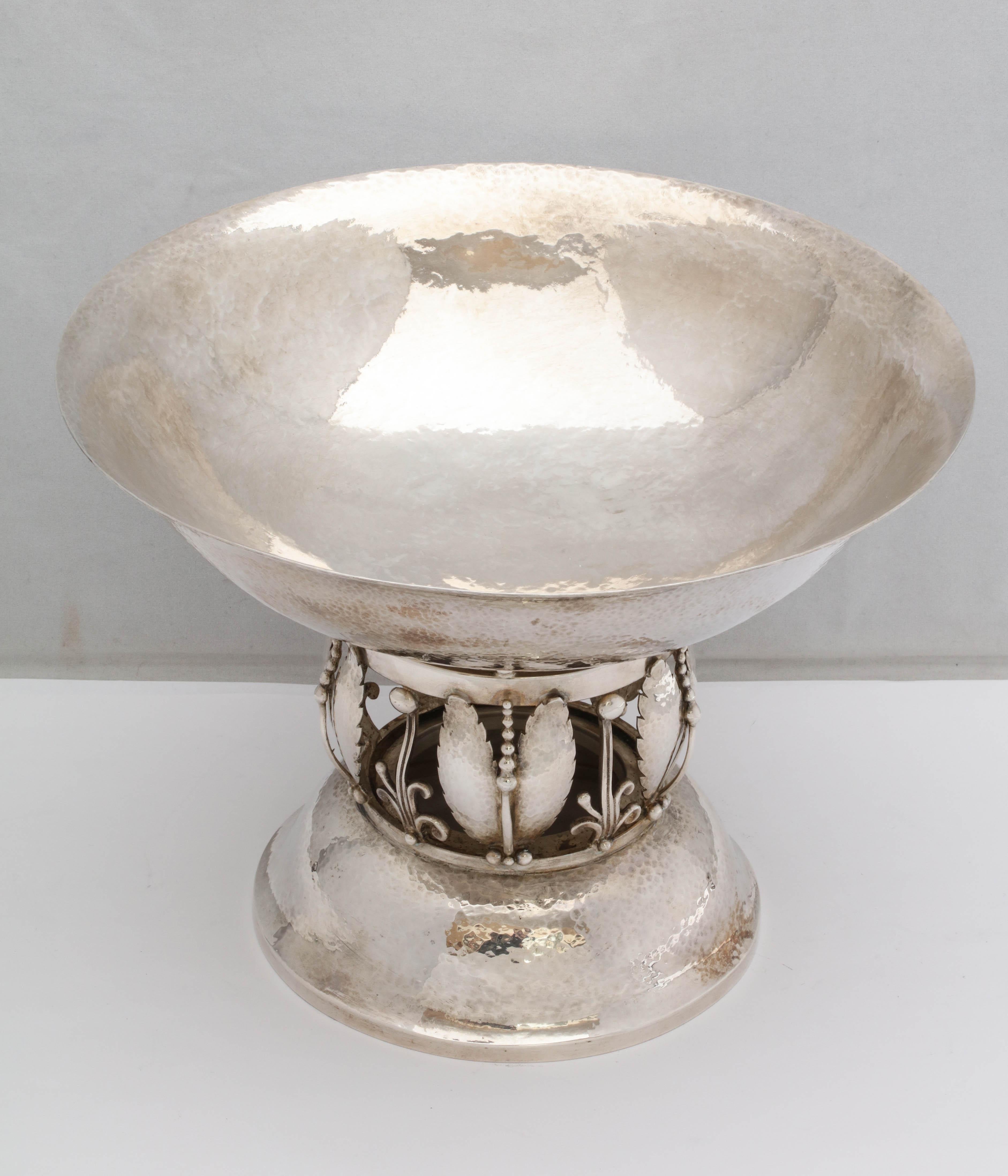 Art Deco, Jensen-Style, sterling silver centerpiece bowl, Gorham Manufacturing Co., Providence, Rhode Island, year-hallmarked for 1954. Bowl is hammered in design. Measures 9 5/8 inches in diameter across top opening x 7 1/8 inches high. Weighs