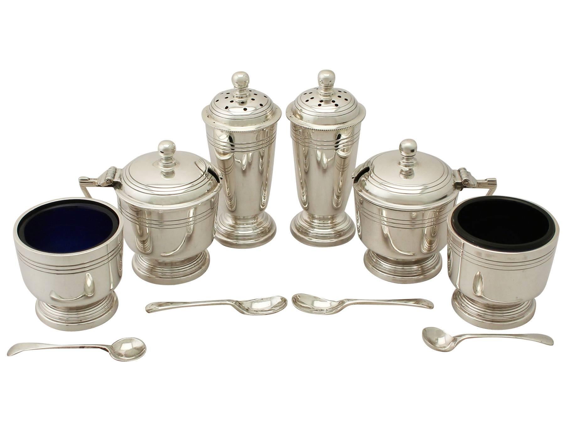 An exceptional, fine and impressive vintage Elizabeth II English sterling silver six-piece condiment set in the Art Deco style - boxed; an addition to our dining silverware collection.

This exceptional vintage Elizabeth II sterling silver six