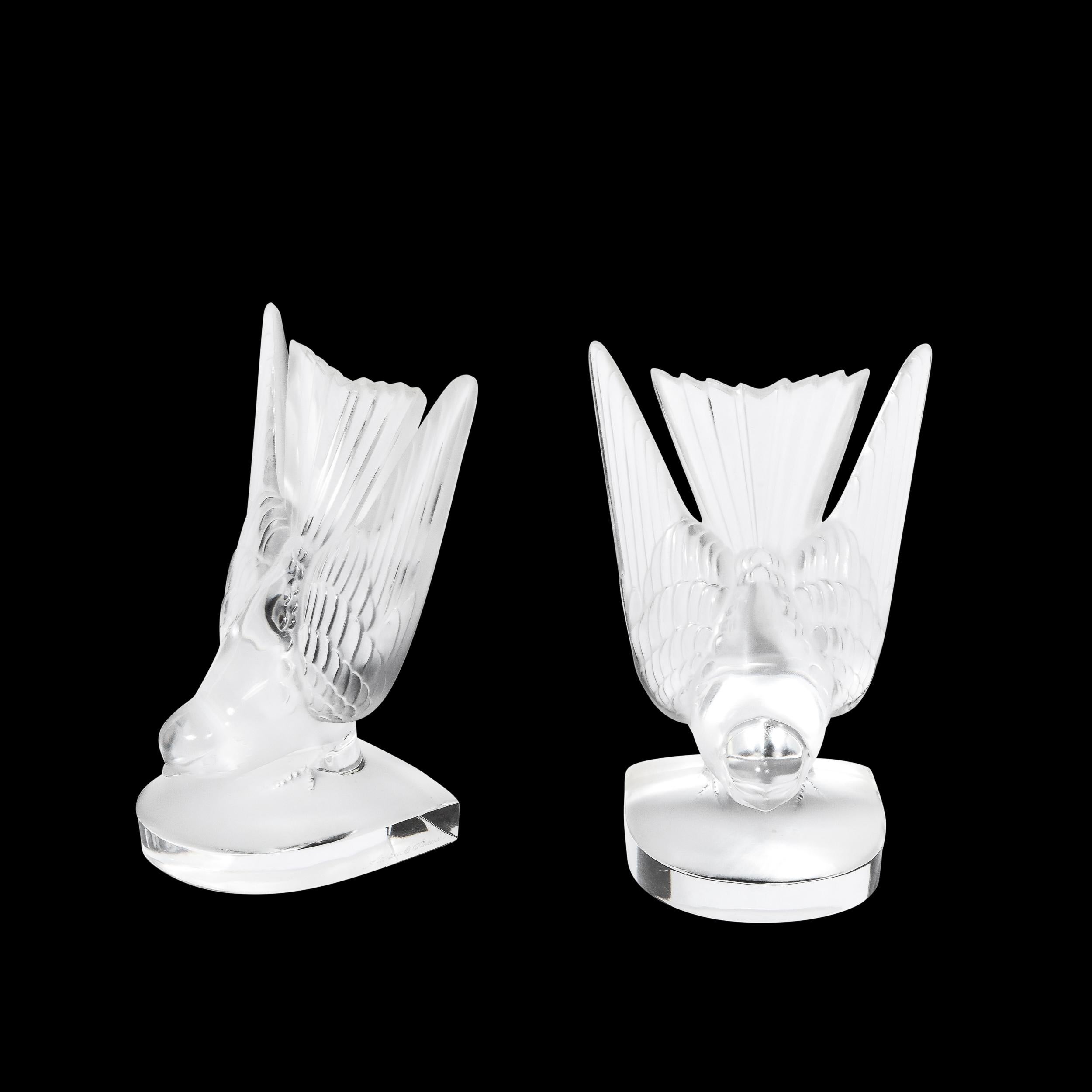 These gorgeous Art Deco Style 'Swallow' Bookends by the esteemed Art Glass Company 'Lalique' originate from France during the latter half of the 20th Century. Featuring truly elegant stability and beautiful design throughout, the Swallow Bookends