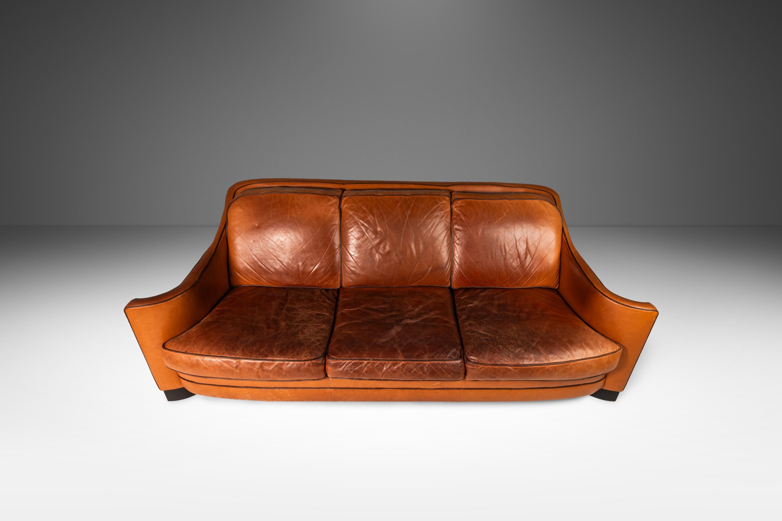 American Art Deco Style Three-Seater Sofa with Sculptural Arms in Patinaed Leather, 1970s For Sale