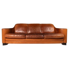 Art Deco Style Three-Seater Sofa with Sculptural Arms in Patinaed Leather, 1970s