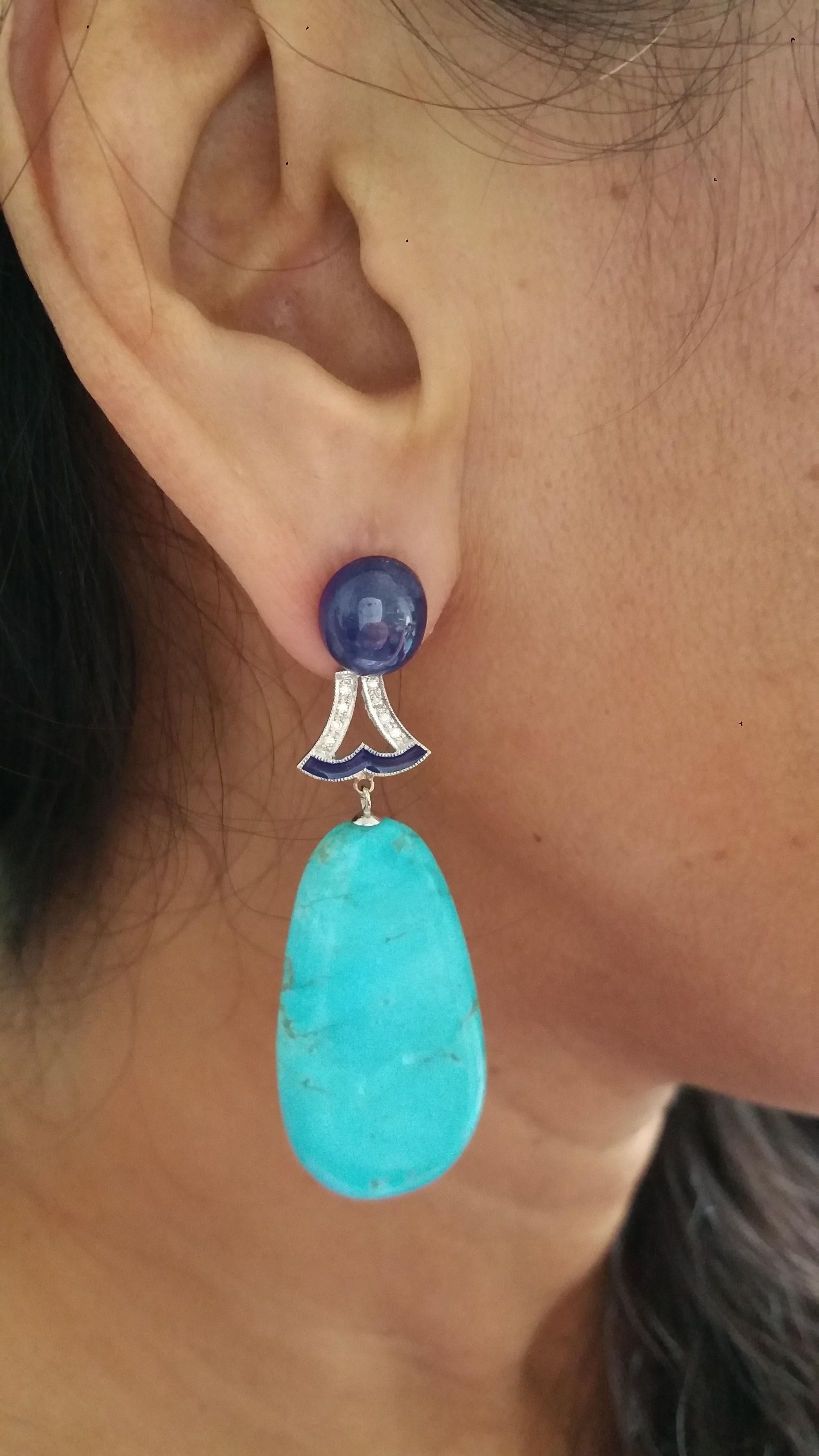 Blue Sapphire oval cabochons tops ,middle parts in white gold,16 round full cut diamonds,blue enamels,2 big flat genuine Turquoise drops.
Length 63 mm
Width 20 mm
Weight 17 grams
In 1978 our workshop started in Italy to make simple-chic Art Deco