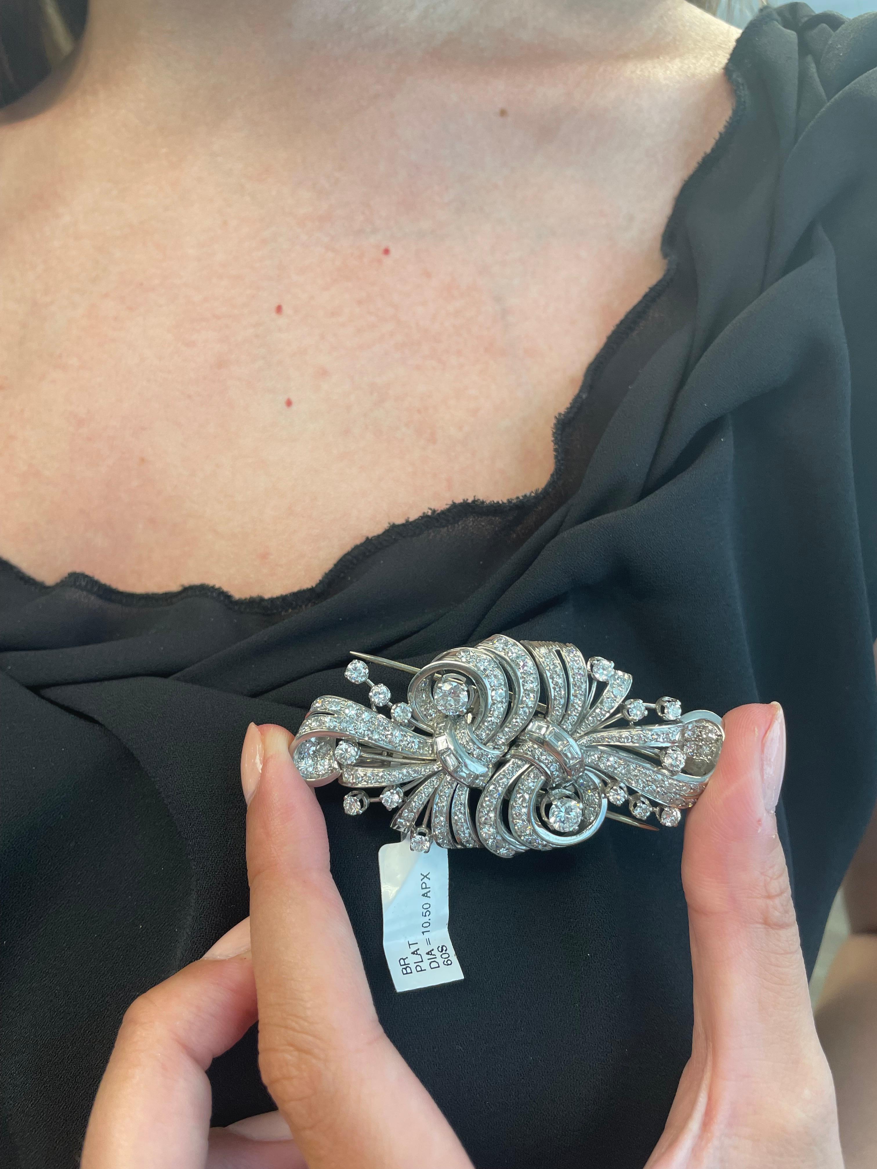 Stunning high jewelry art deco style brooch that can split into two brooches.
Approximately 10.50 carats of round and baguette cut diamonds. Approximately G/H color and VS2/SI1 clarity. Platinum, 2.5in width. 
Accommodated with an up to date