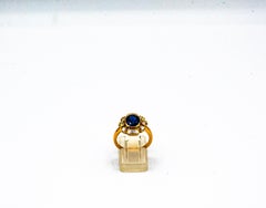 Art Deco Style White Diamond Blue Oval Cut Sapphire Yellow Gold Cocktail Ring