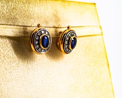 Orecchini a leva in oro giallo con diamante bianco e zaffiro blu in stile Art Deco