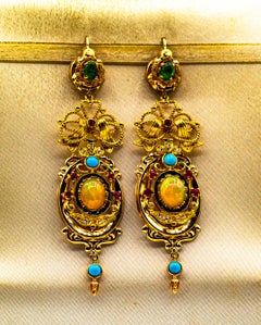 Orecchini in oro giallo in stile Art Deco con diamante bianco, smeraldo, rubino, opale e turchese