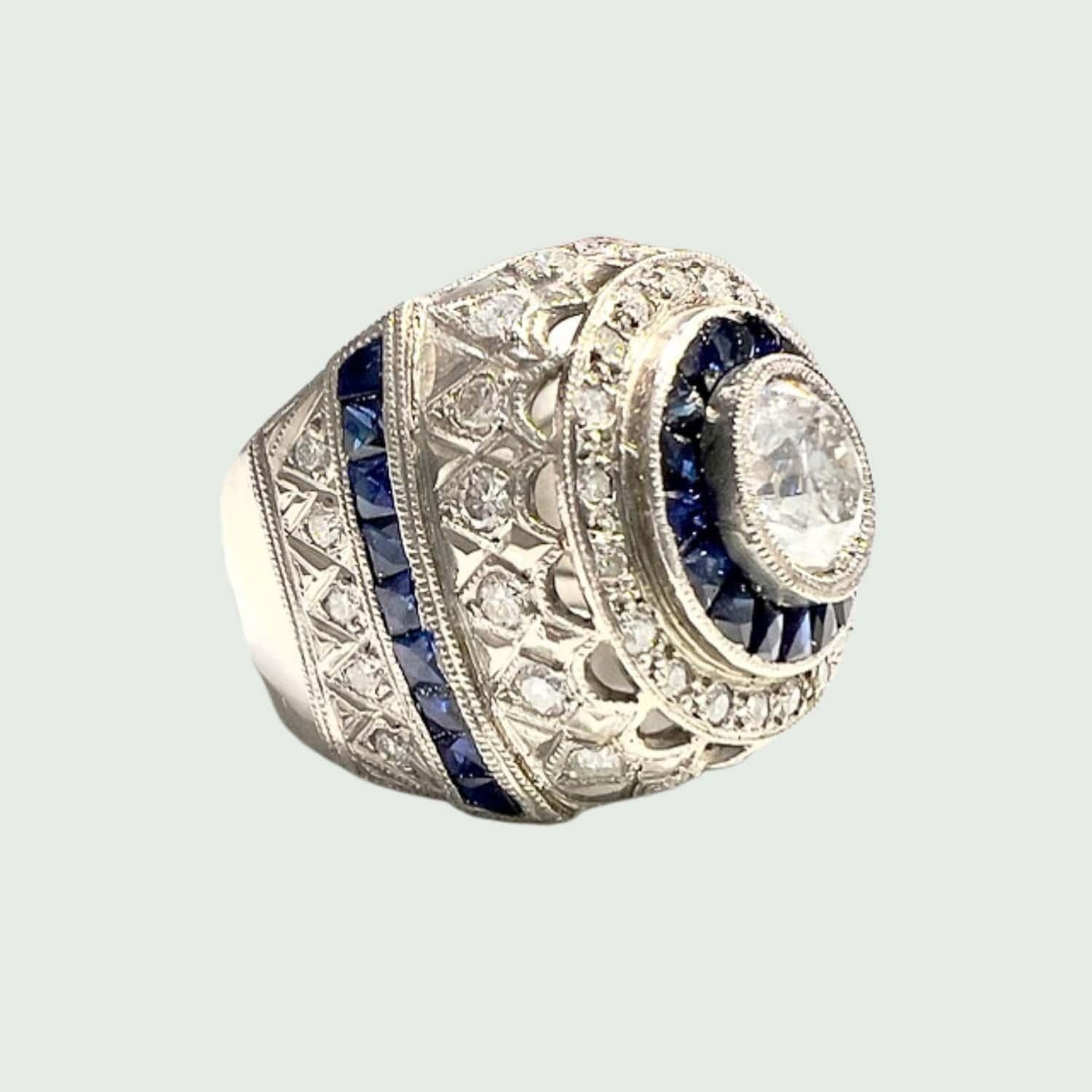 This ring is truly unique, offering a blend of vintage charm and modern sophistication. The combination of platinum, diamonds, and sapphires creates a striking contrast that captures the eye and elevates any ensemble.

** IN STOCK**

Technical