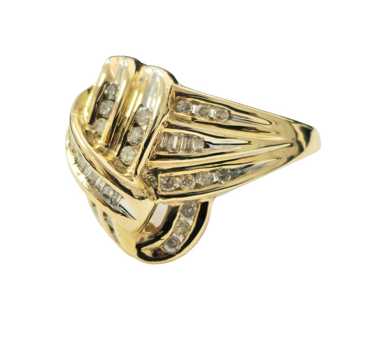 Indulge in the allure of vintage elegance with this captivating 14k yellow gold engagement ring. Adorned with a total of 2.10 carats of diamonds, featuring baguette and round cuts, this ring exudes timeless sophistication. The diamonds, with SI2