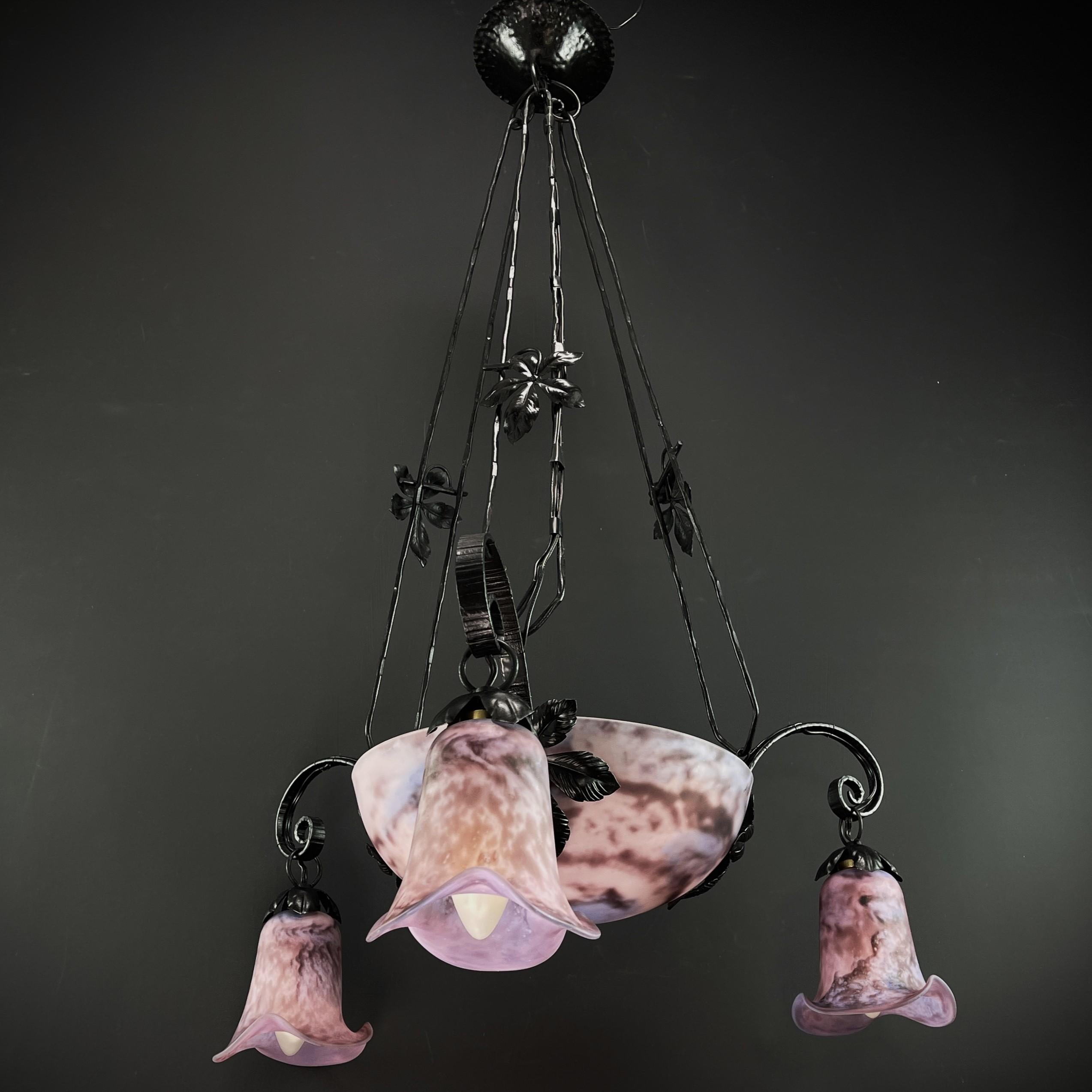Art Deco Style wrought iron Lamp Pate de Verre

The ceiling lamp is a remarkable example of the craftsmanship and style of the early 20th century.

This ceiling lamp skilfully combines the robust wrought iron with the elegance of Pate de Verre