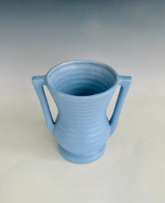 Art Deco styled vessel with concentric ring design in sky blue glaze