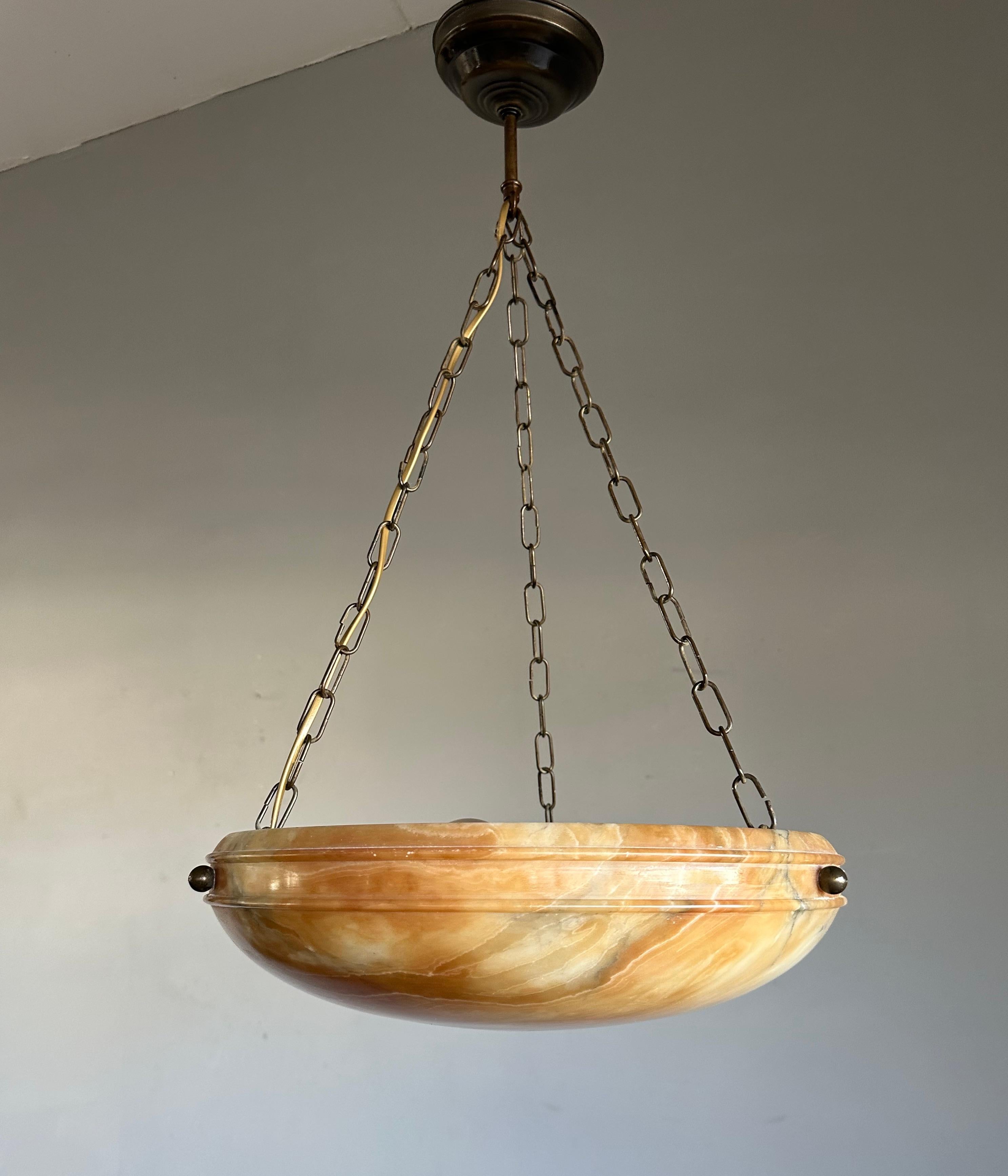 One of a kind light fixture with a stunning “ flameboyant “ alabaster shade disc.

Thanks to its timeless design, its good size and its truly mint condition this alabaster chandelier will light up both your days and evenings, both in summer and