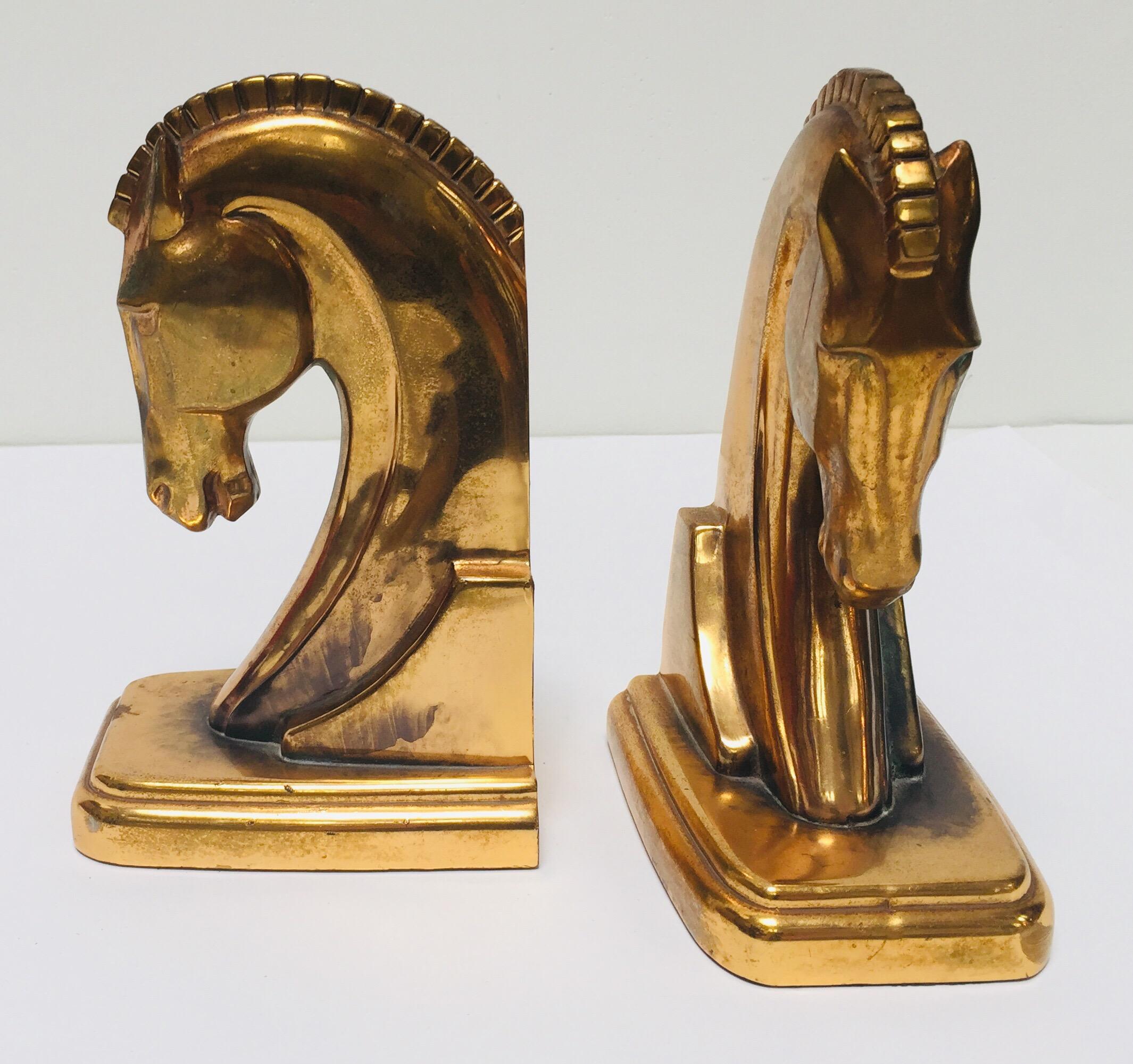 Vintage Art Deco style cast brass stylized horse head sculptures bookends.
Great to use on a desk as a paper weight or decorative objects around the house or office.
Art Deco stylized horse head bookends in brass patinated metal.
Measures each: 4