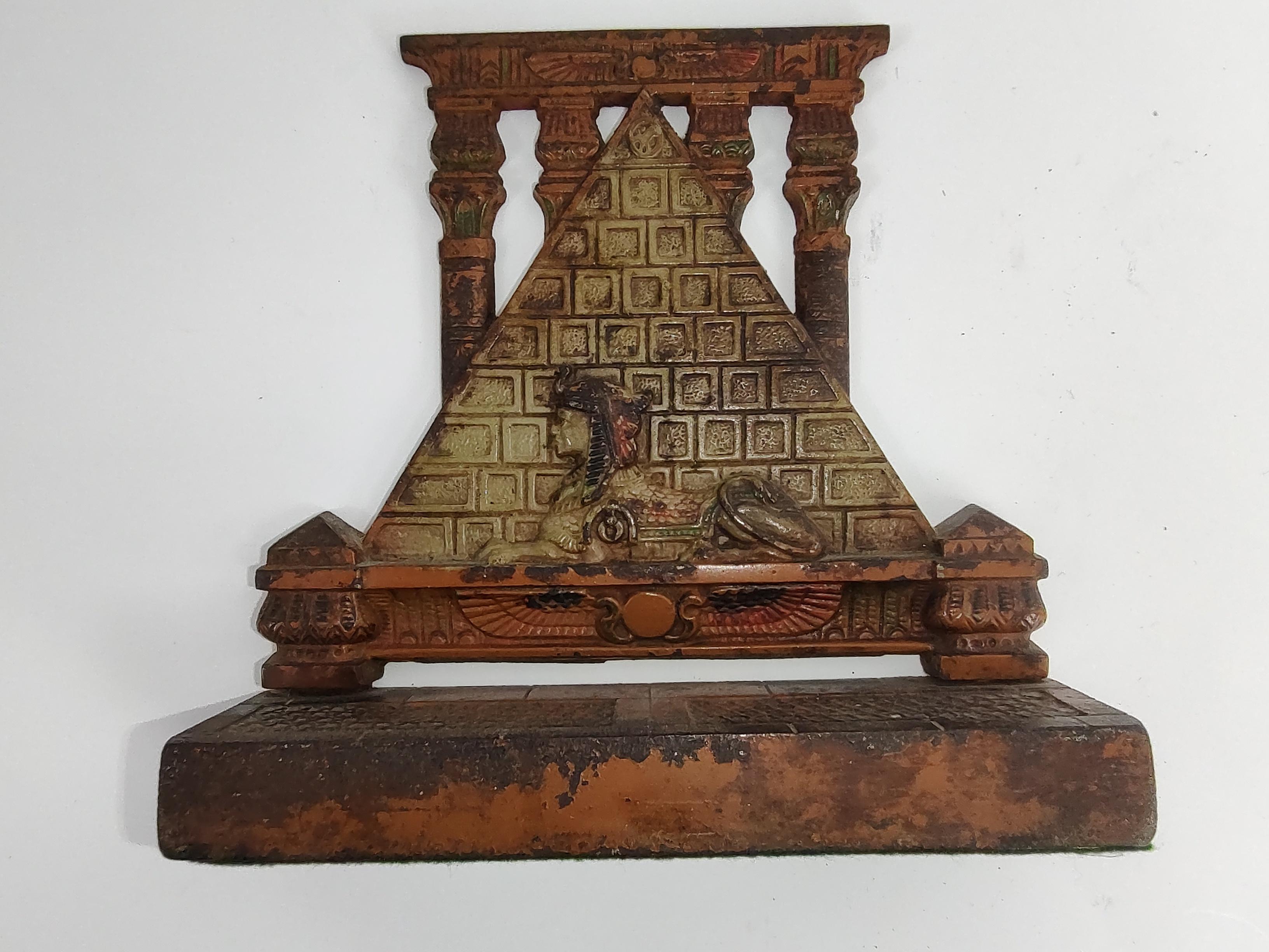 Mid-20th Century Art Deco Stylized Cast Iron Doorstop Sphinx with Pyramid and Original Paint For Sale
