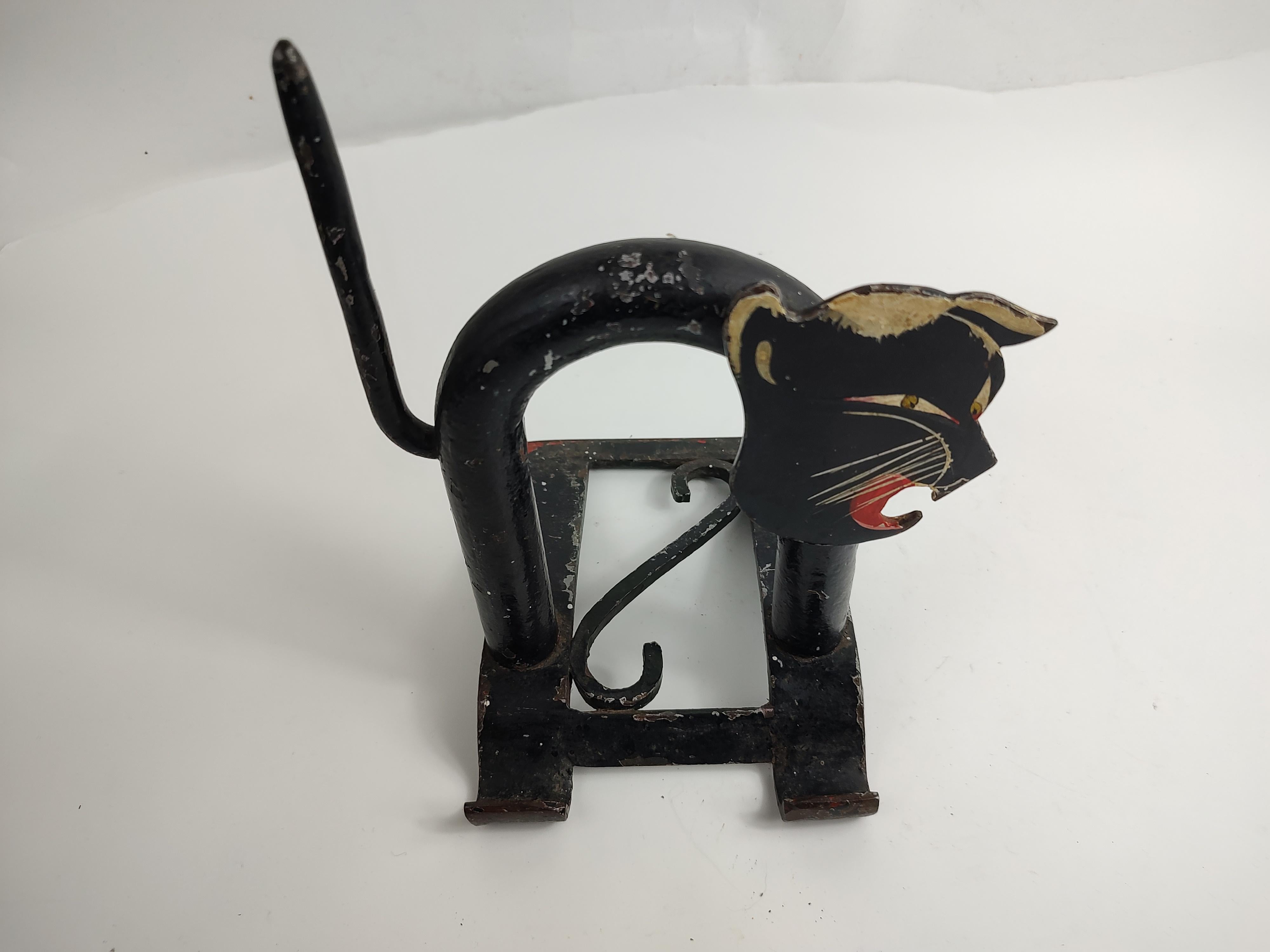 Fabulous screeching black cat door stop in iron & steel. Stylized in the manner of Walter Von Neesen for Chase. In excellent vintage condition with minimal wear.