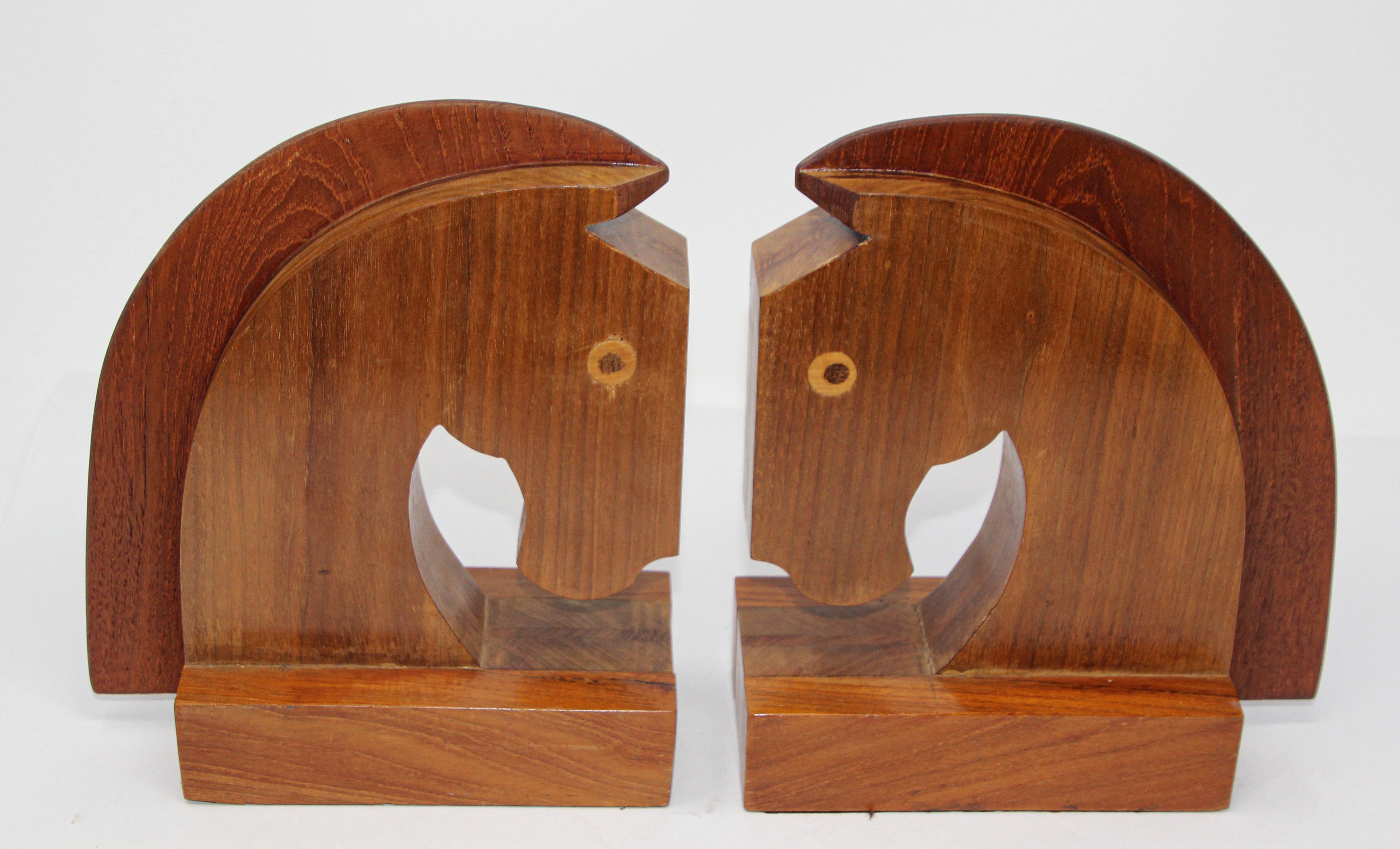 Vintage Art Deco style wood stylized horse head sculptures bookends.
Great to use on a desk as a paper weight or decorative objects around the house or office.
Art Deco stylized horse head bookends.
Measures each: 4