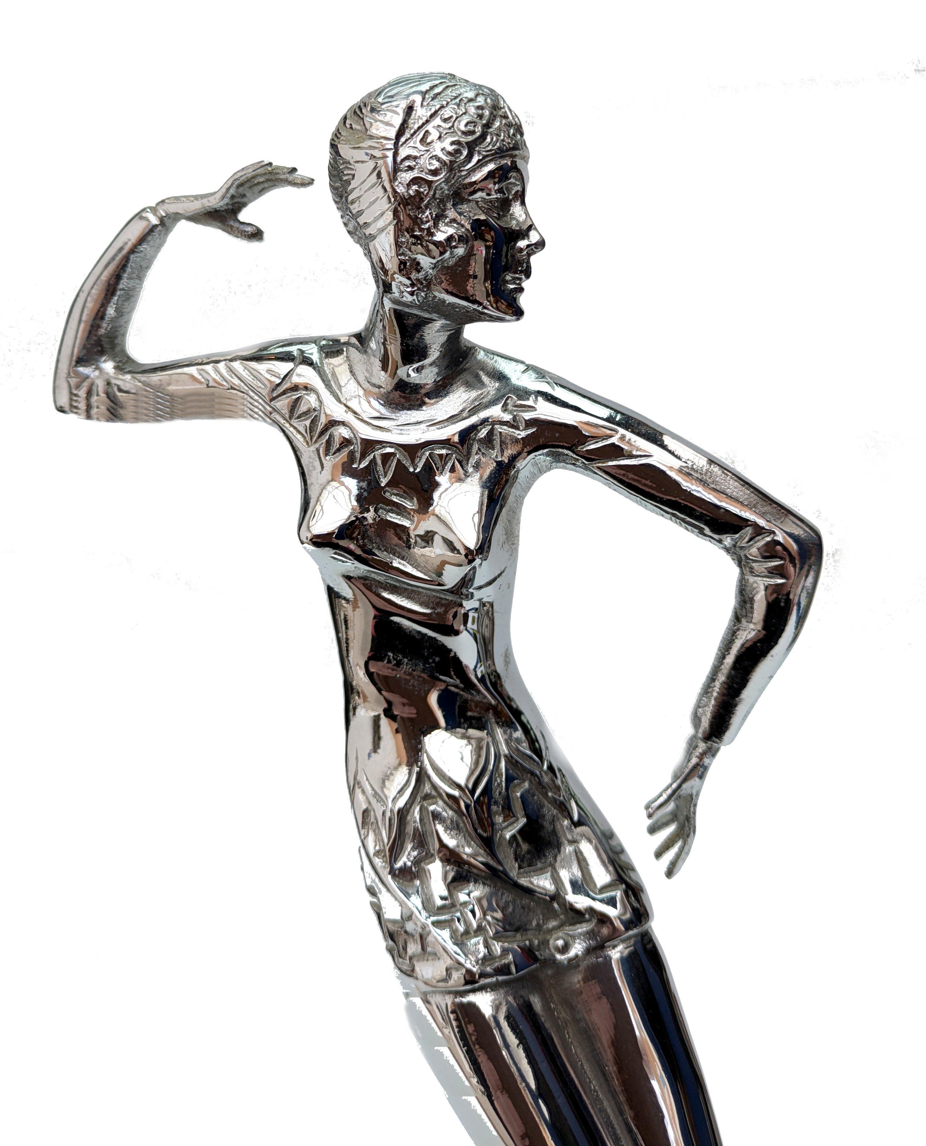 Standing over 30 cm tall and in fabulous condition is this superbly stylish Art Deco lady in the fashion of the day dance pose. The statue is made of high-quality chrome material, ensuring its durability and longevity. The intricate details of the