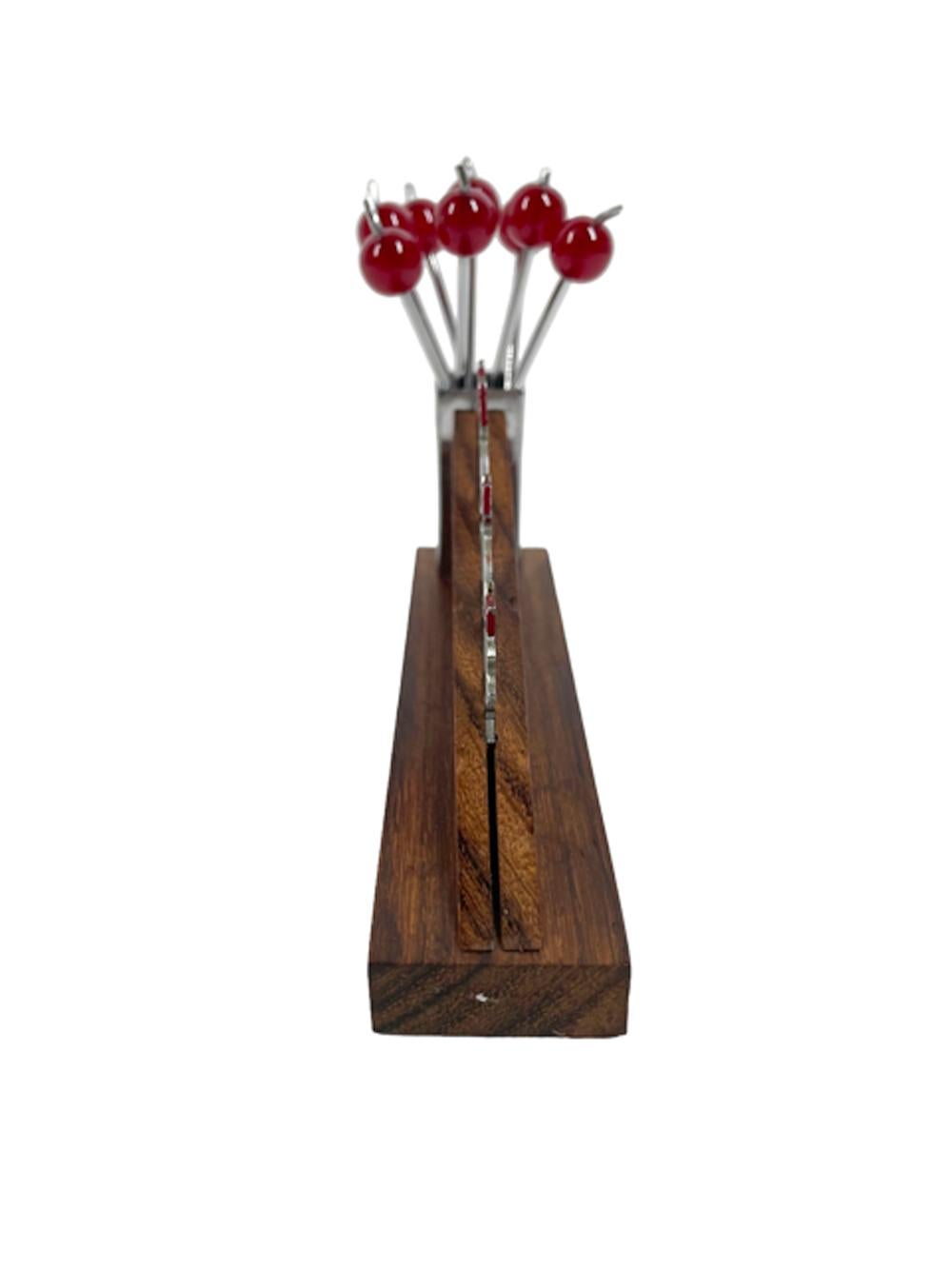French Art Deco cocktail pick set in the manner of Sudre with 3 chrome ducks wearing hats walking up a ramp of wood carved as a block wall ending in a chrome post holding 8 fork tipped 