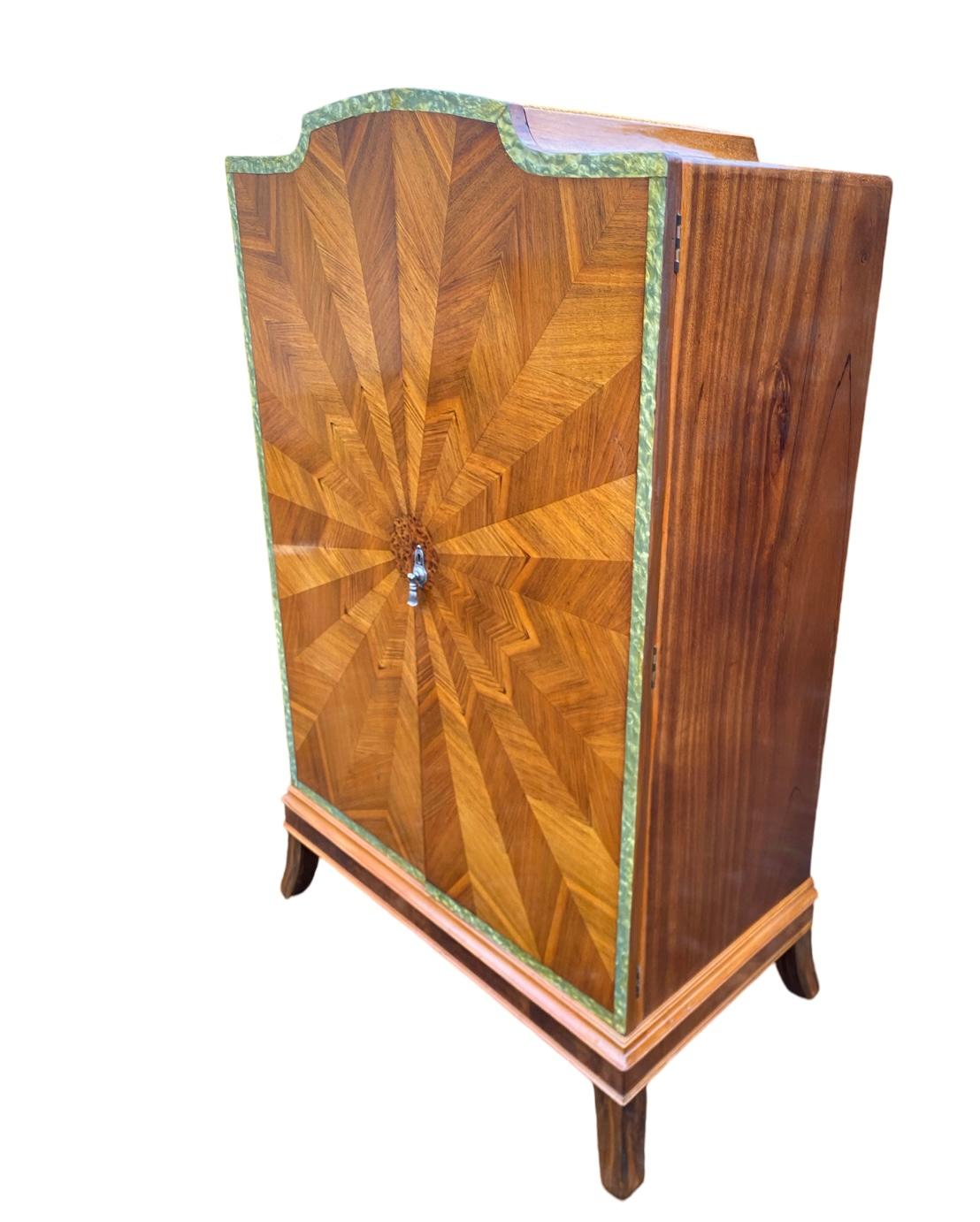We are proud to present this beautiful Art Deco Tallboy dating to Circa 1930. Striking sunburst veneers to the entire front, various shades and grains of walnut creating this wonderful iconic sunburst paytern with central circular motif in burr
