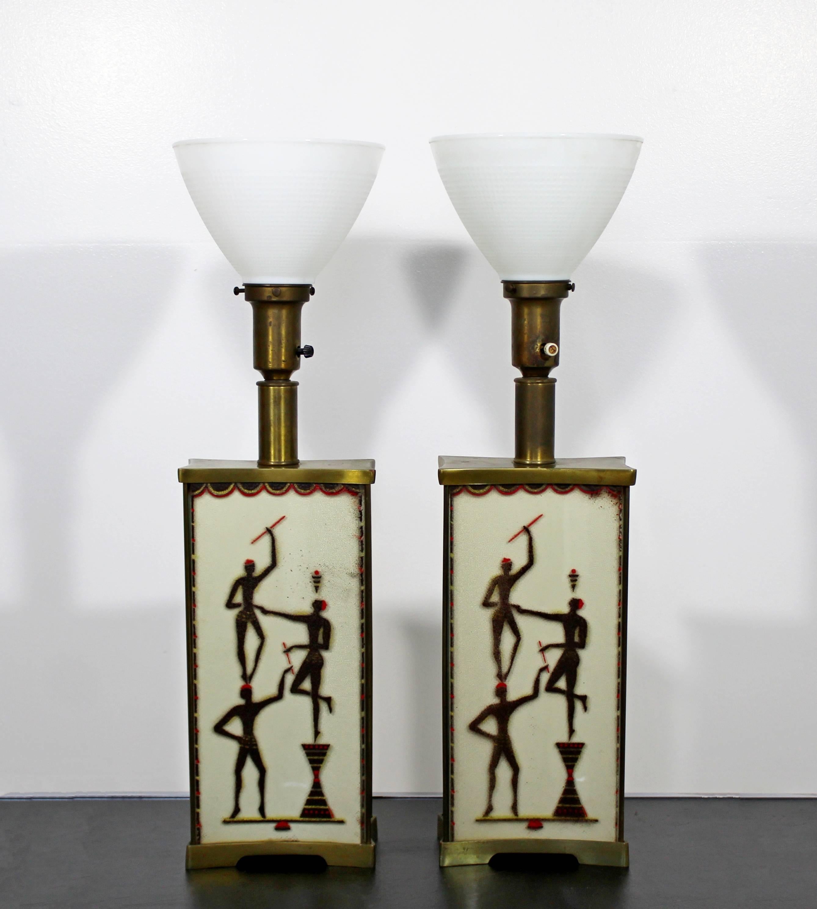 For your consideration is a magnificent, super rare pair of four glass panel, tribal table lamps, with their original glass reflectors, by Maurice Heaton. In excellent condition. The dimensions are 8