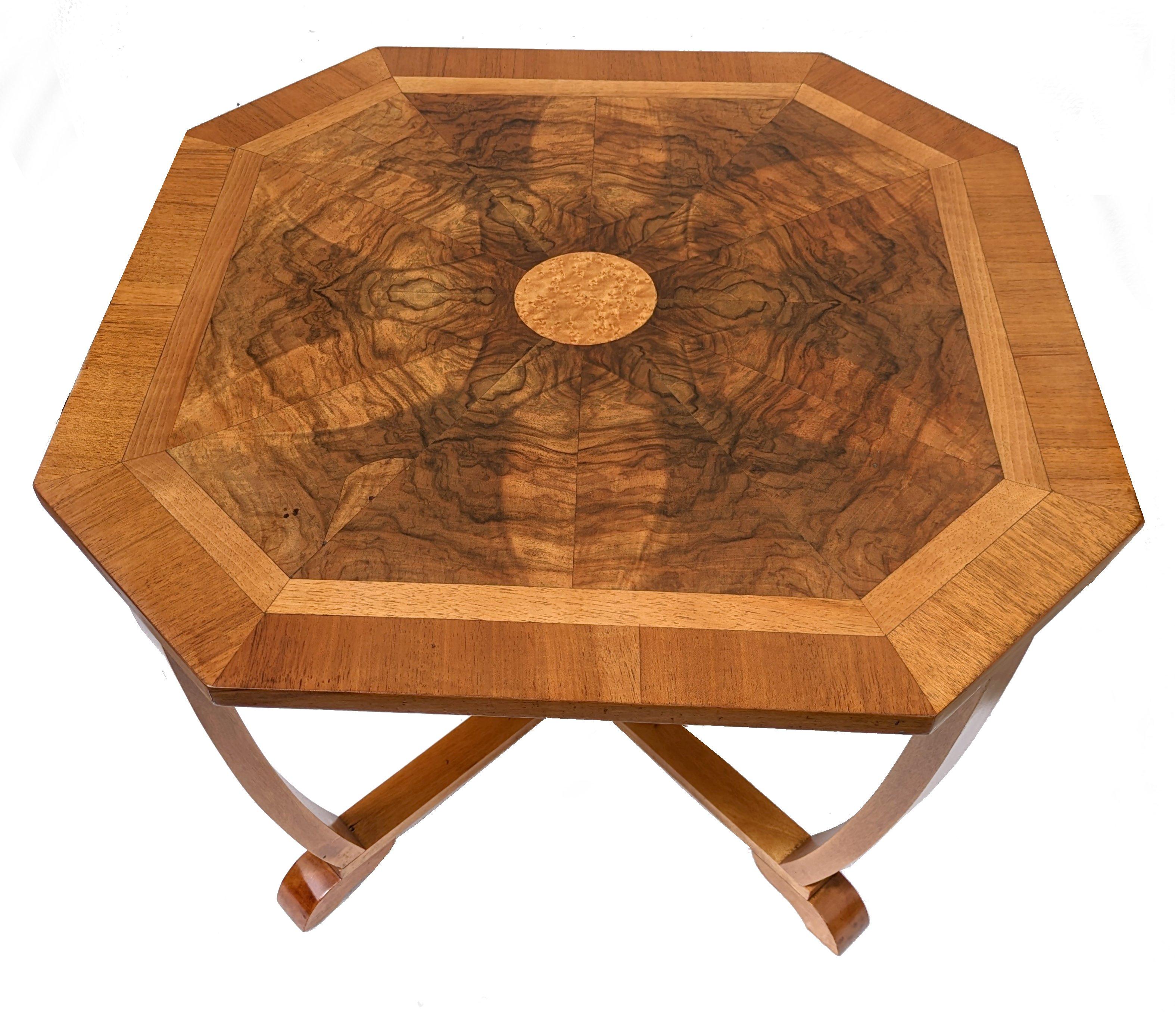 This is a beautiful and original 1930's Art Deco set of five tables in Burr Walnut. This gorgeous set comprises one large central octagon edged table with four matching sectional tables that are two tiered that fit very snugly underneath. As you can