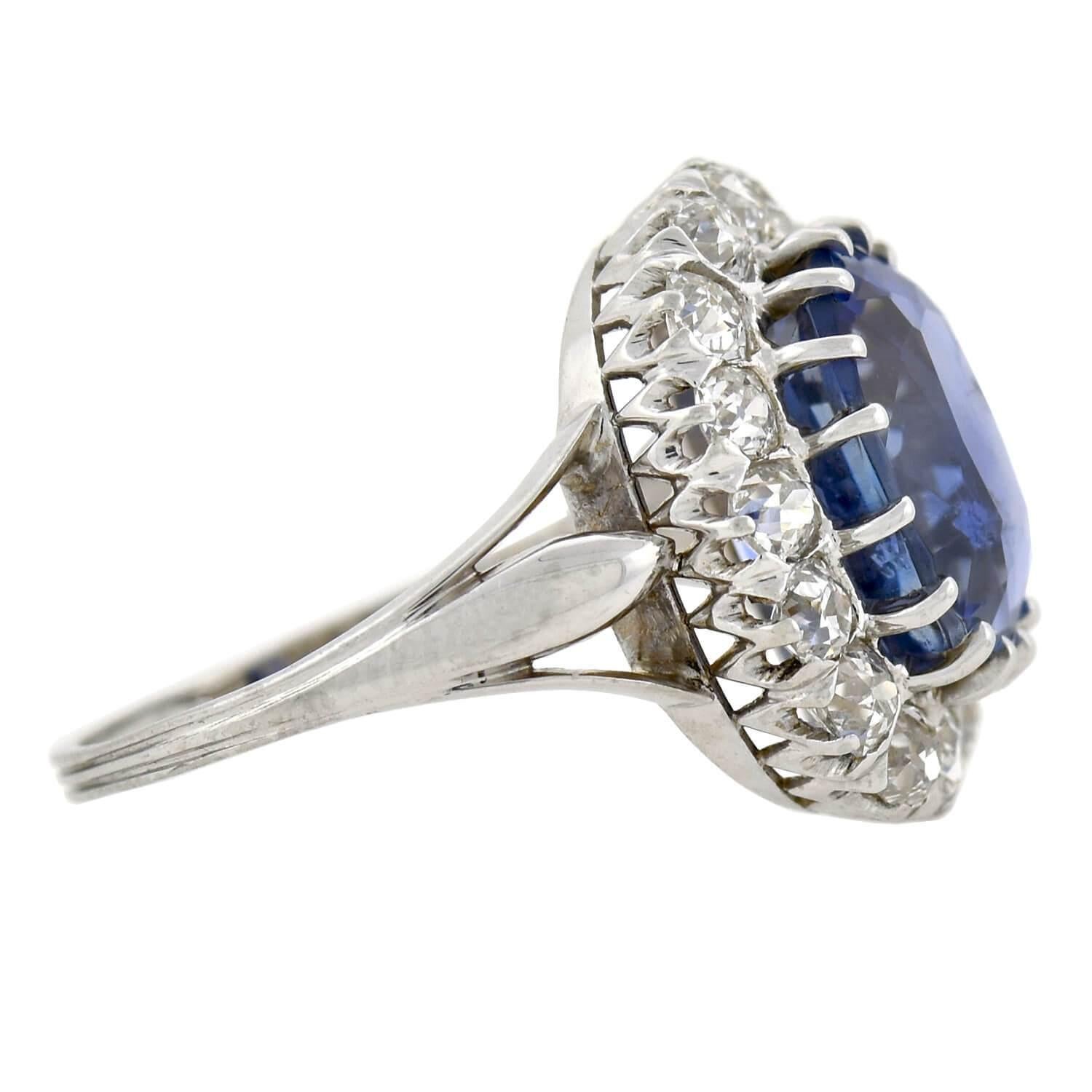 A truly spectacular sapphire and diamond ring from the Art Deco (ca1925) era! This Swedish-made piece is crafted in platinum and adorns an approximately 5.10ct Ceylon sapphire at the center of a sparkling diamond border. The stunning multi-prong set
