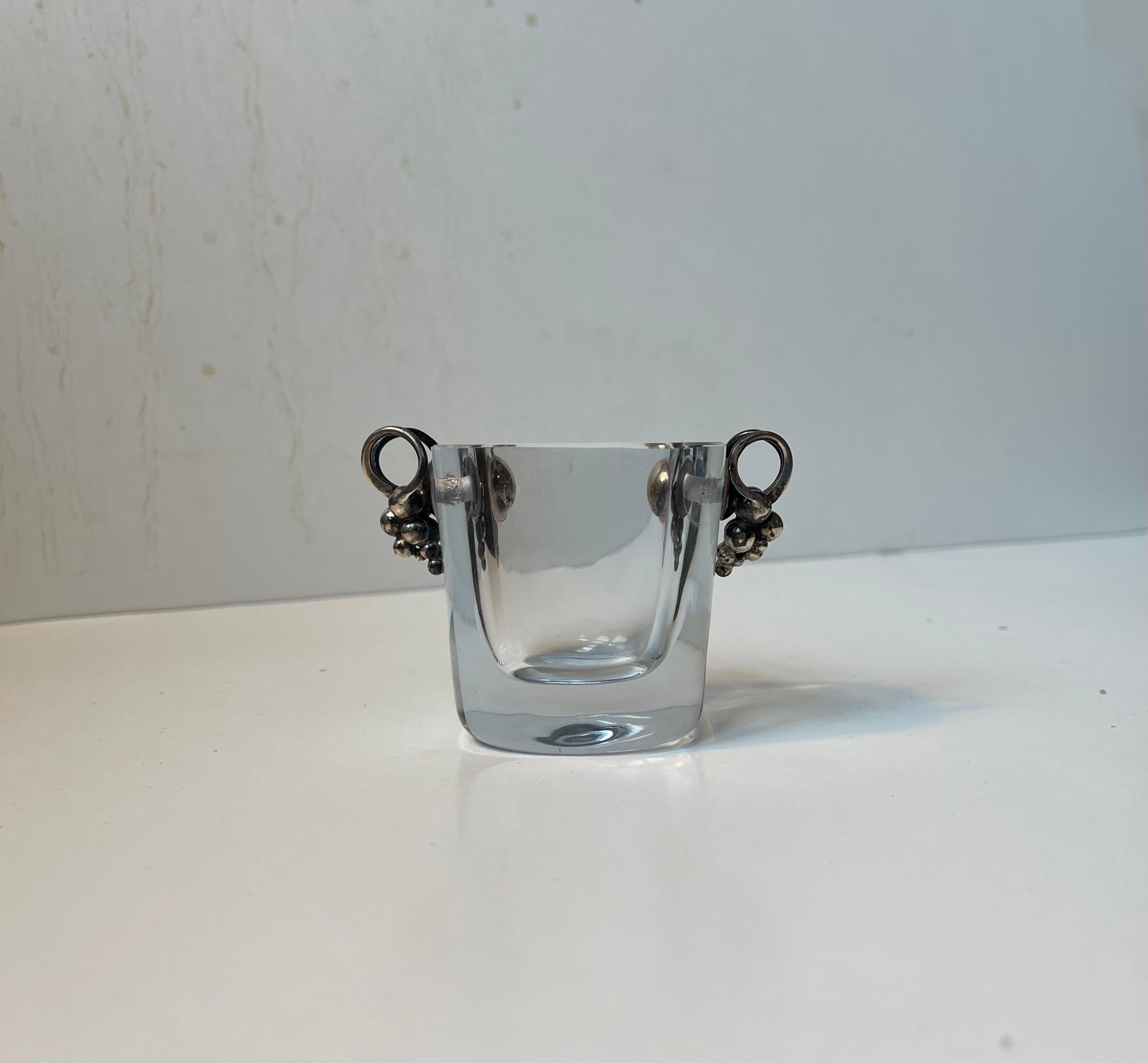 Exquisite, petite yet thick crystal vase with solid sterling silver grape pendants hanging loosely to each side. Designed by the Danish silversmith Einar Dragsted during the 1930s accompanied by Swedish Strömbergshyttan who from the 1930s up till