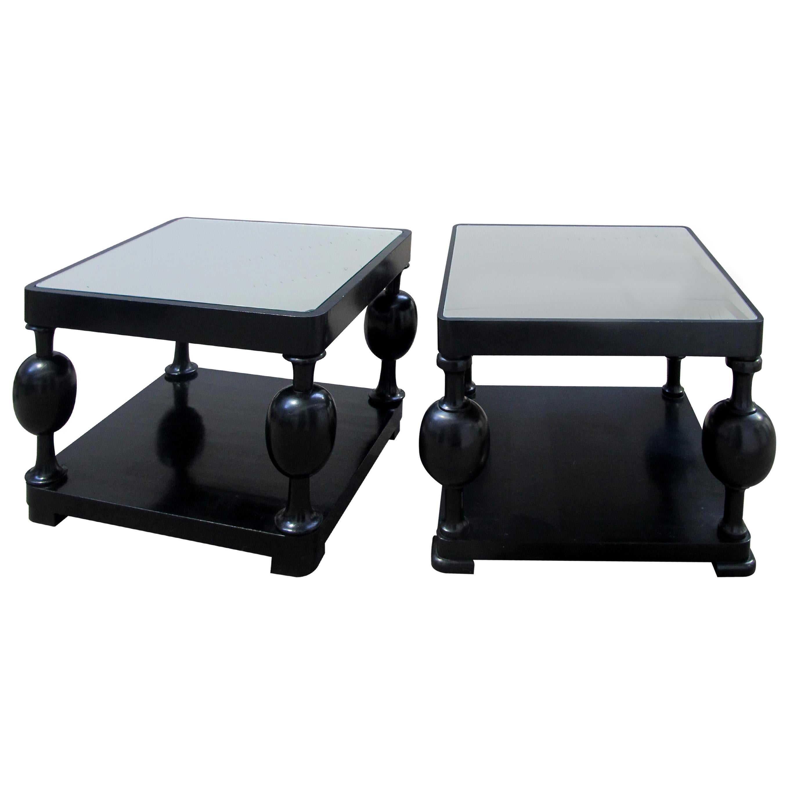 Set of two truly exceptional Art Deco Swedish side tables with mirrored tops. The tables have been made with birch wood and ebonized to achieve a stunning contemporary look without compromising on the Art Deco design. The legs between the two tiers