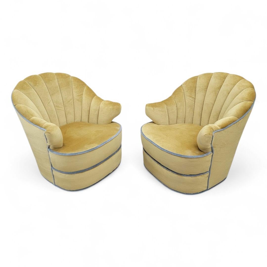 Art Deco Channel Back Swivel Lounge Chairs Newly Upholstered in a Sol Yellow Mohair with Aqua Trim - Pair

Elevate your living space with these exquisite 1940s Art Deco channel back swivel lounge chairs, newly upholstered in luxurious Sol Yellow