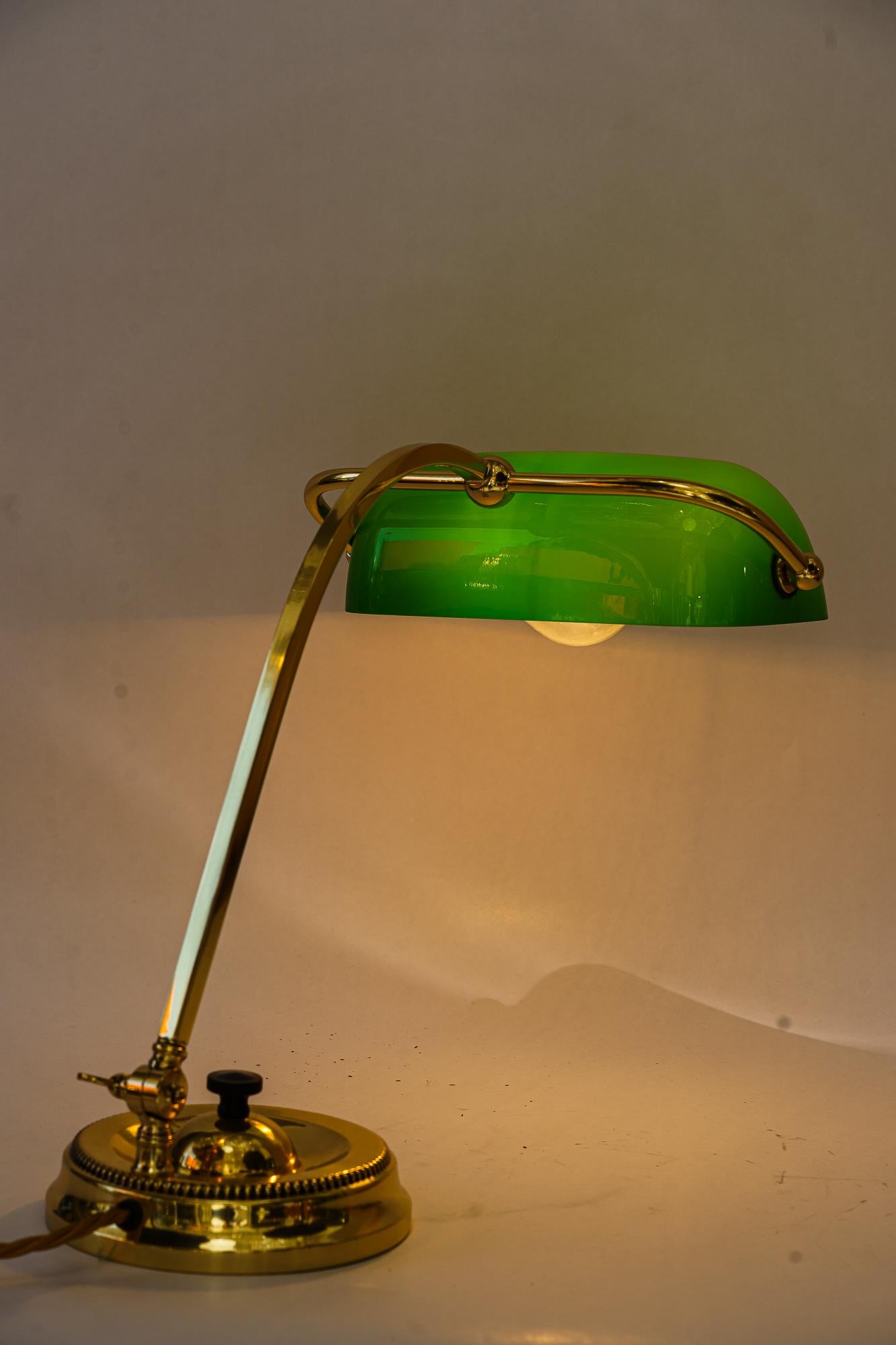 Early 20th Century Art Deco swiveling banker table lamp with green glass vienna around 1920s For Sale