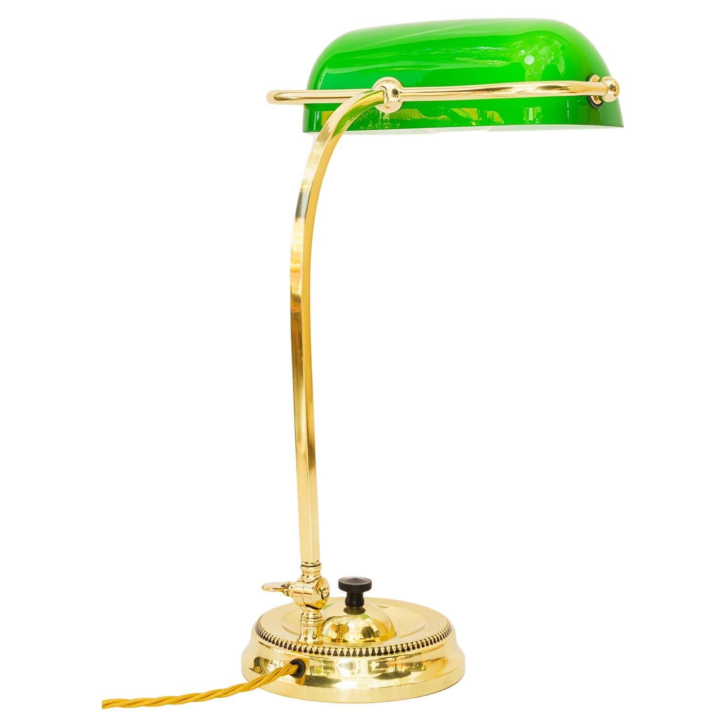 Art Deco swiveling banker table lamp with green glass vienna around 1920s For Sale