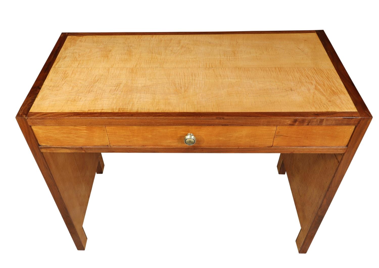 Art Deco Sycamore writing table, circa 1930
a single drawer writing table produced in France in the 1920s with solid walnut edging and sycamore veneer the table is aesthetically pleasing to the eye, the drawer is of dovetail joint construction with