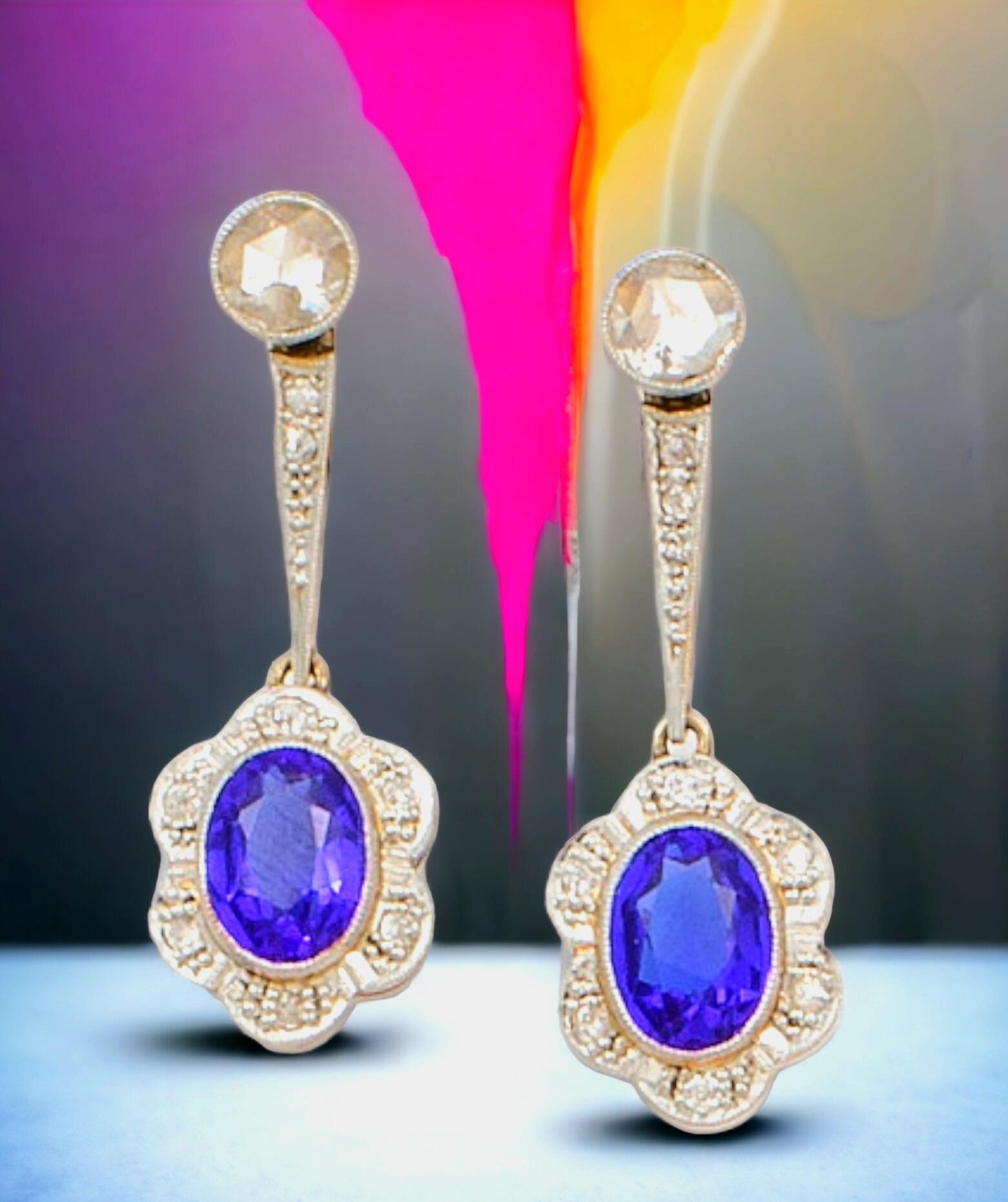 Art-Deco Synthetic Blue Sapphire and Diamond  Drop Earrings.
Each earring features a magnificent cobalt center stone, deep blue with ever-changing flashes of light and dark
These gorgeous  drop earrings feature a 3.00 carat central oval cut