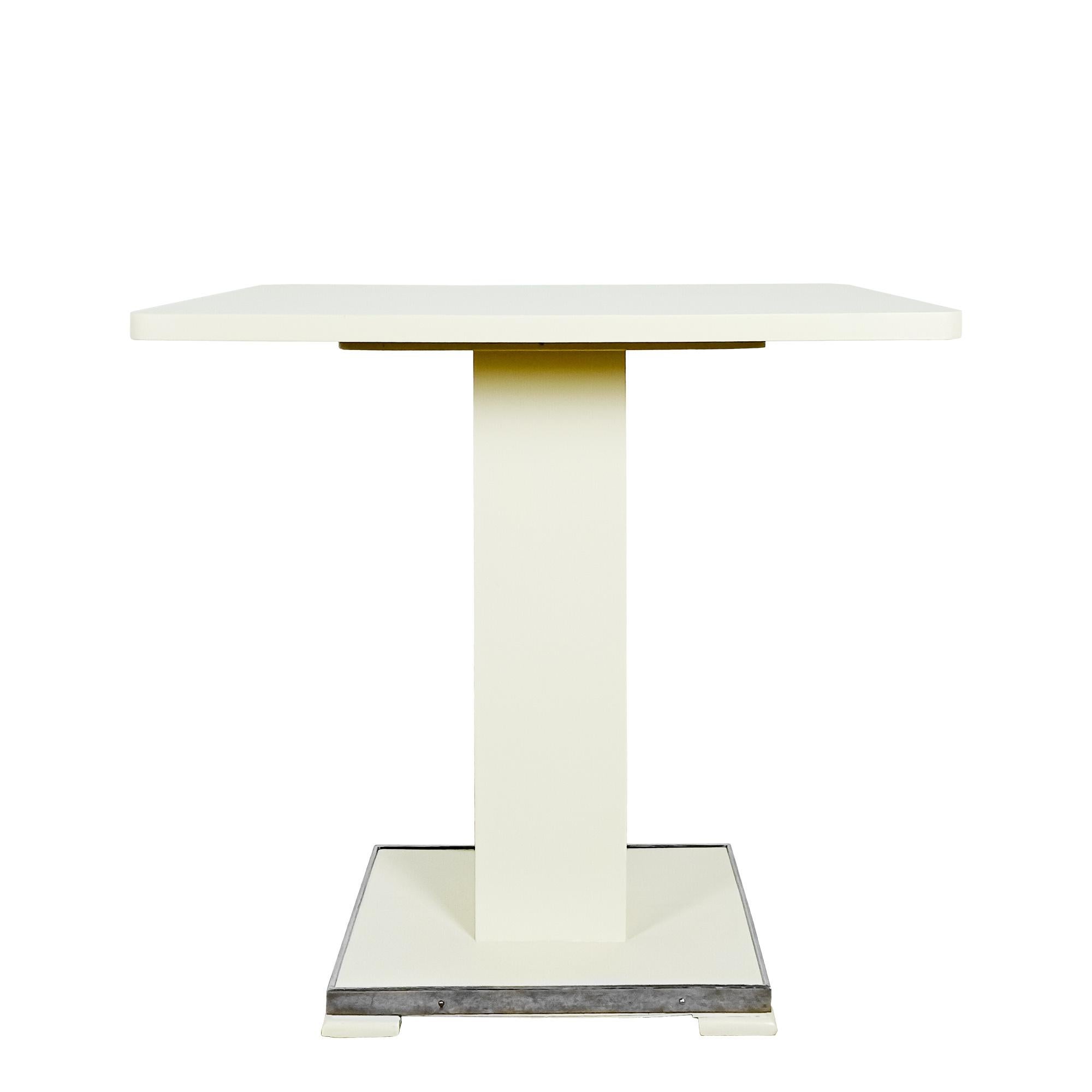 Art Deco table and two chairs with an ivory satin lacquered finish, Art Deco period fabric, designed and produced by De Coene Frères.
Courtrai, Belgium circa 1935

Dimensions
1 – Table
cm 70 x 50 x 71
inches 27.56 x 19.68 x 27.95

2 – Chair
cm 43 x