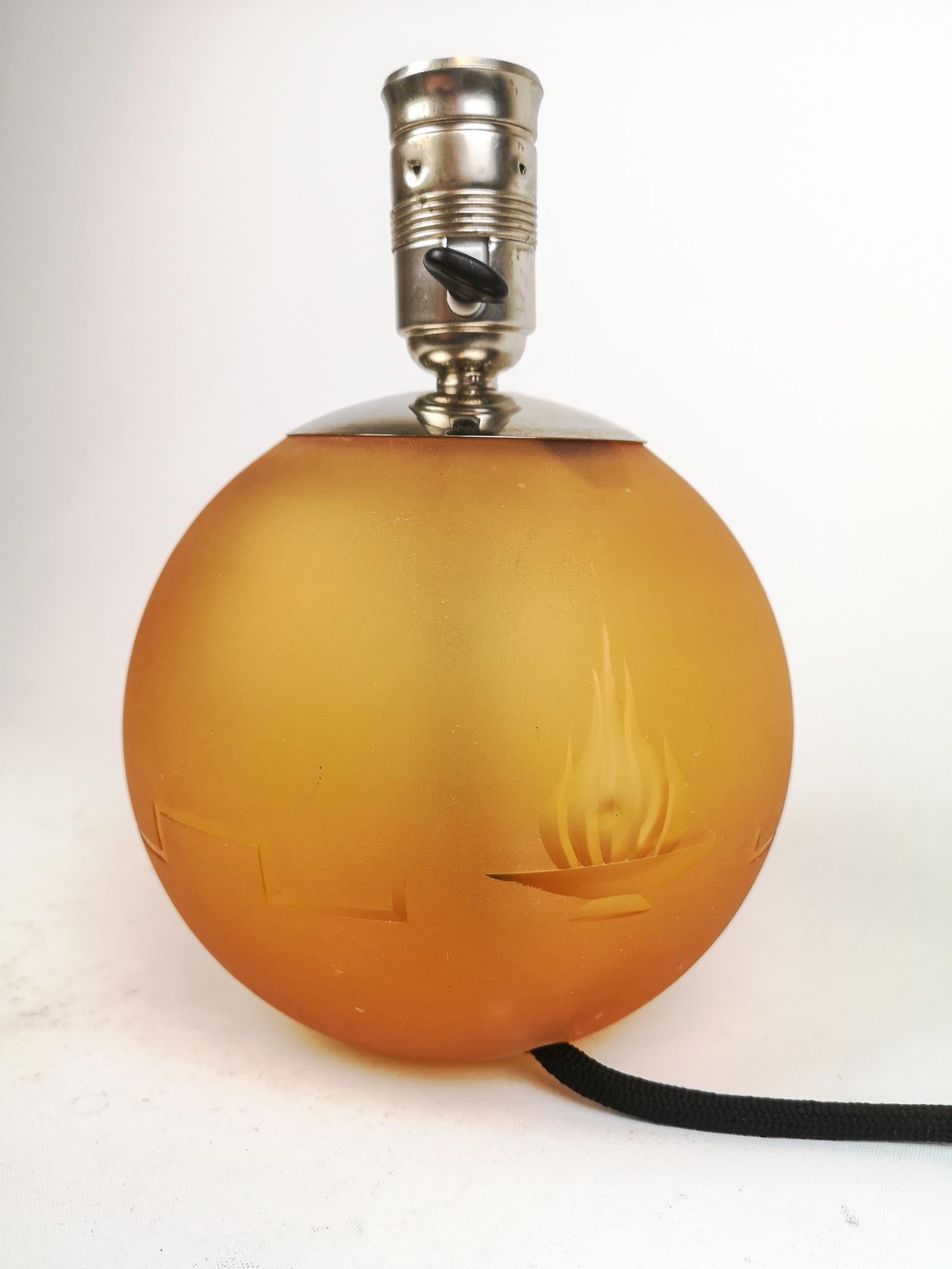 Art Deco table lamp made in art glass and a top of chrome, Sweden, 1930s

Nice looking table lamp in Art Deco style from the period of 1930s. Typical art glass with exceptional color and carved art deco pattern.

Good vintage condition. New